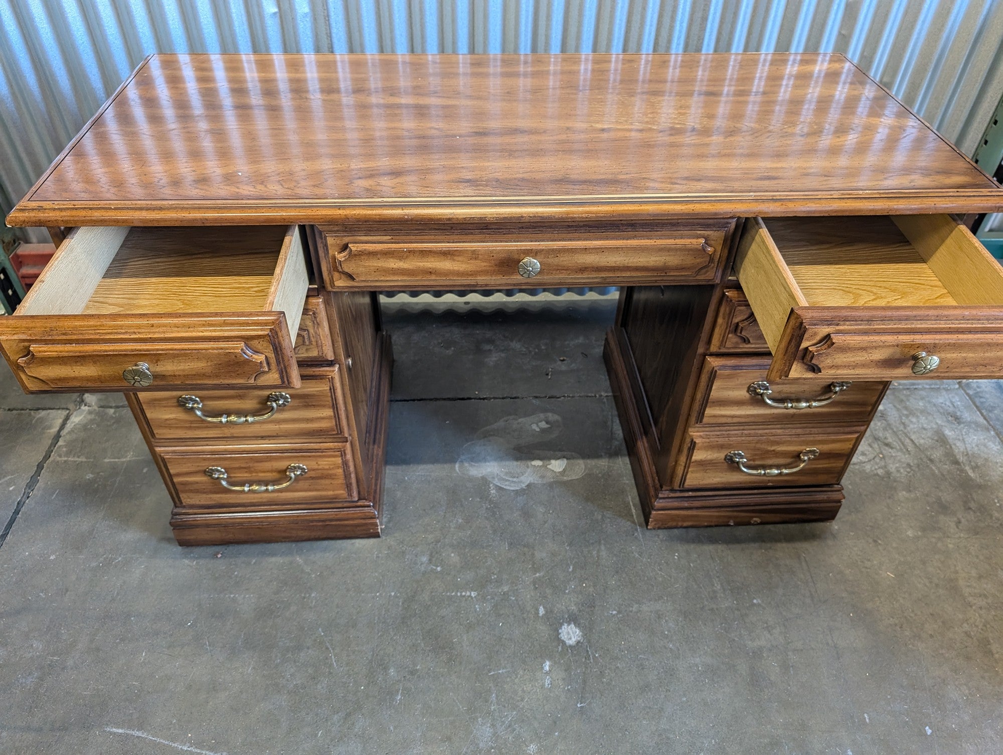 Light wood seven drawer desk