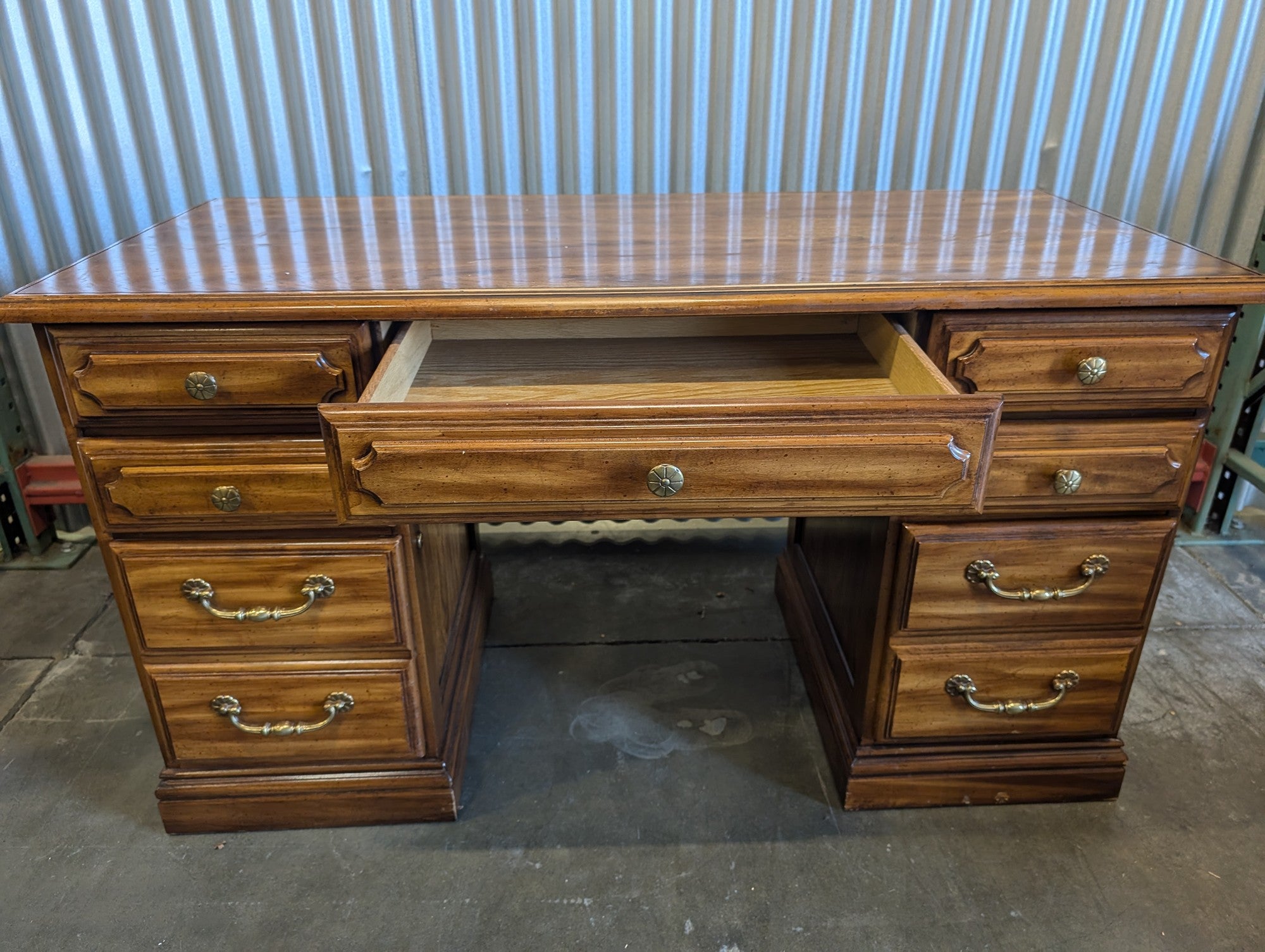 Light wood seven drawer desk