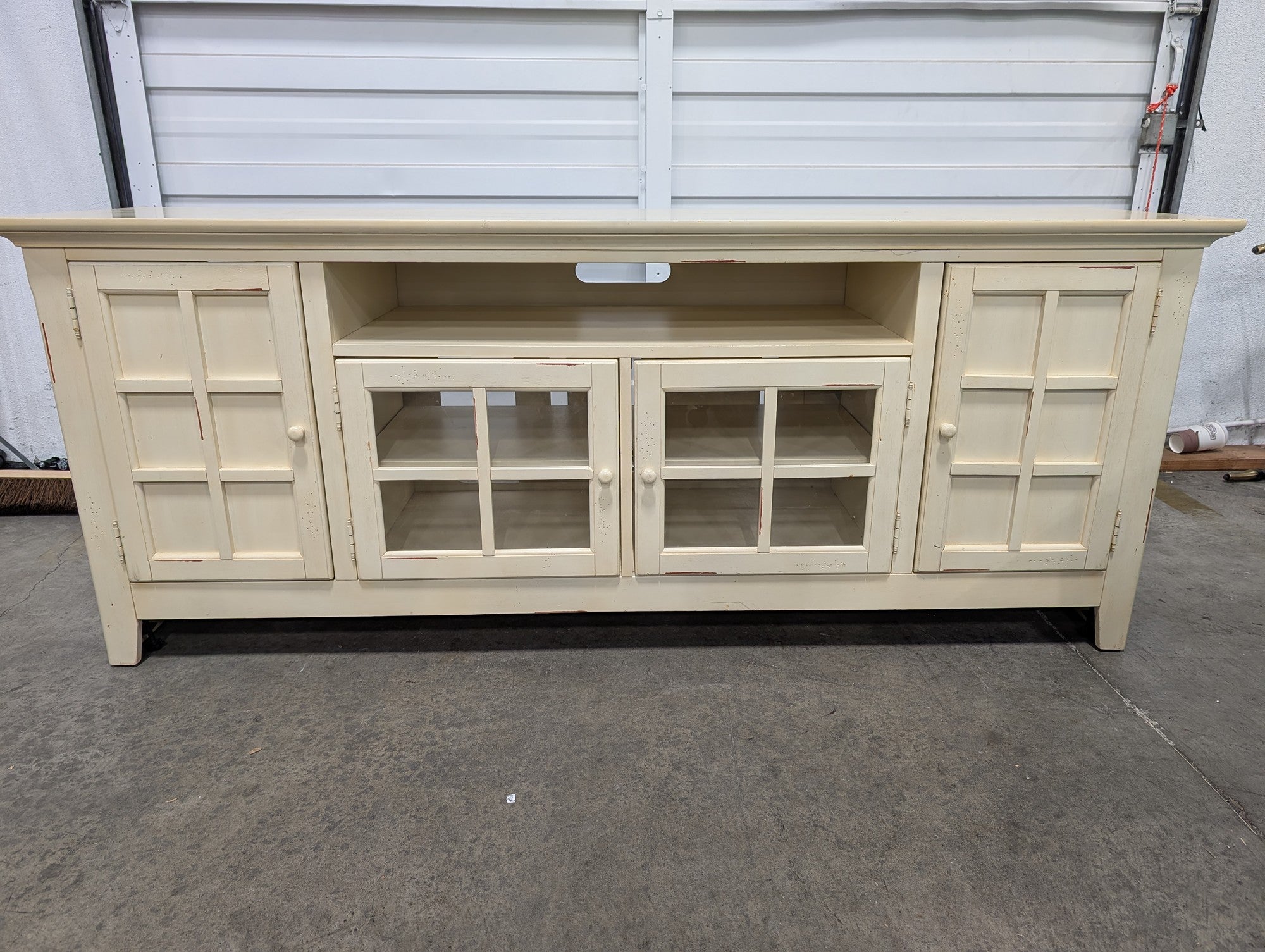 Distressed Cream Wood Media Console with Glass Doors
