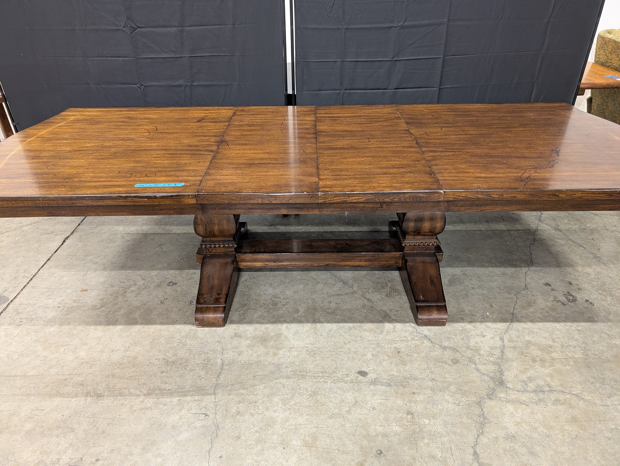 Expansive Dark Wood Pedestal Dining Table with Extension Capability
