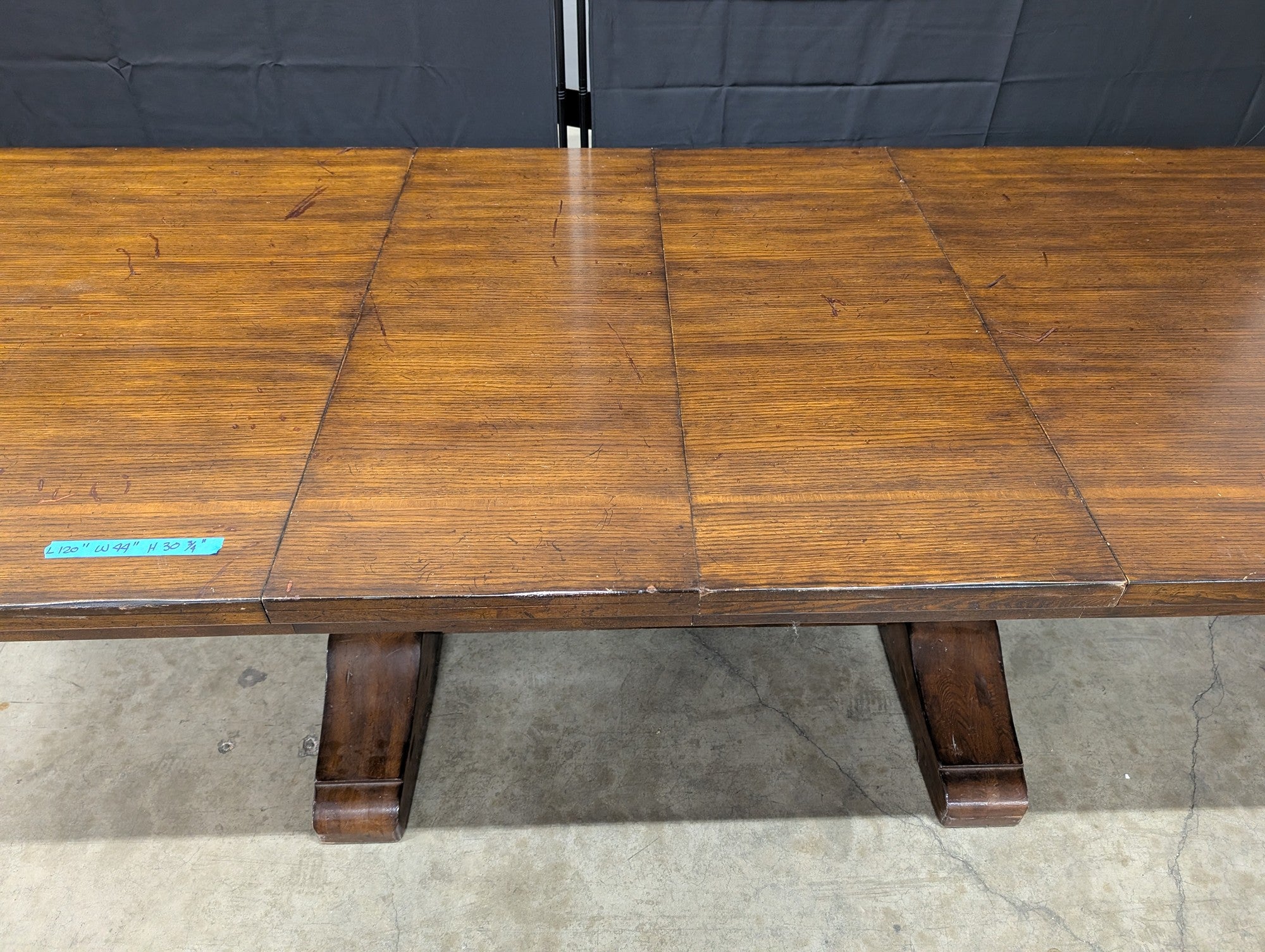 Expansive Dark Wood Pedestal Dining Table with Extension Capability