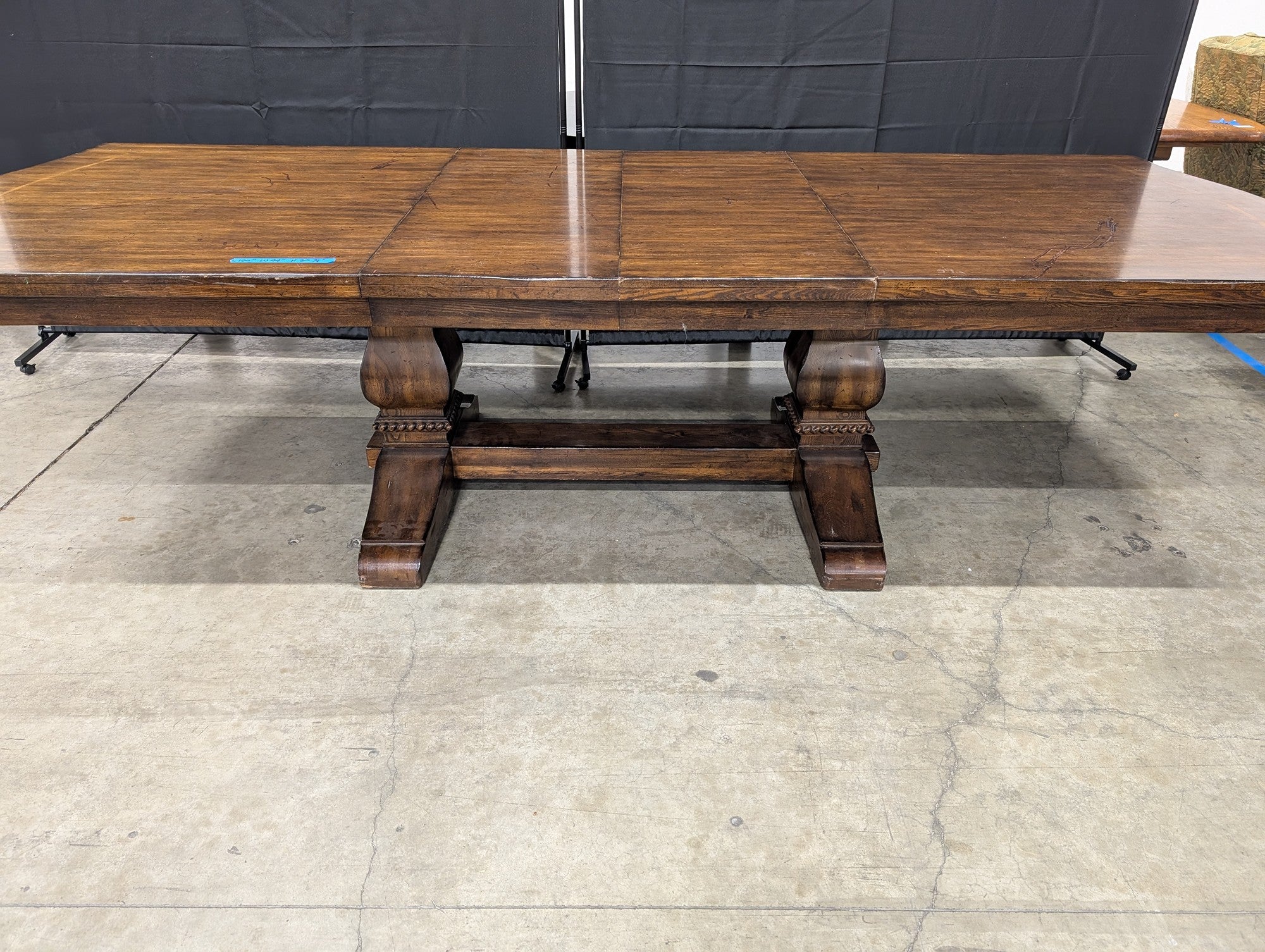 Expansive Dark Wood Pedestal Dining Table with Extension Capability