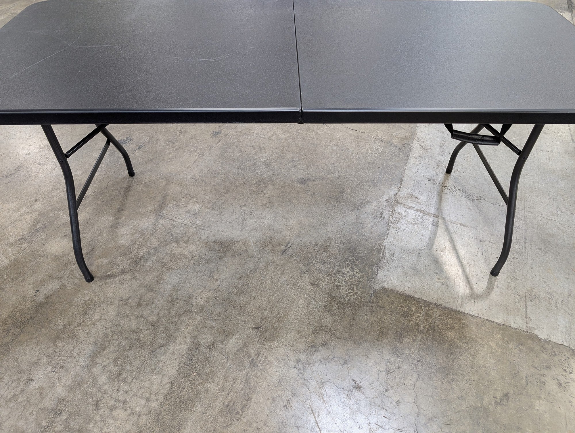 Compact Bi-Fold Utility Table with Carry Handle