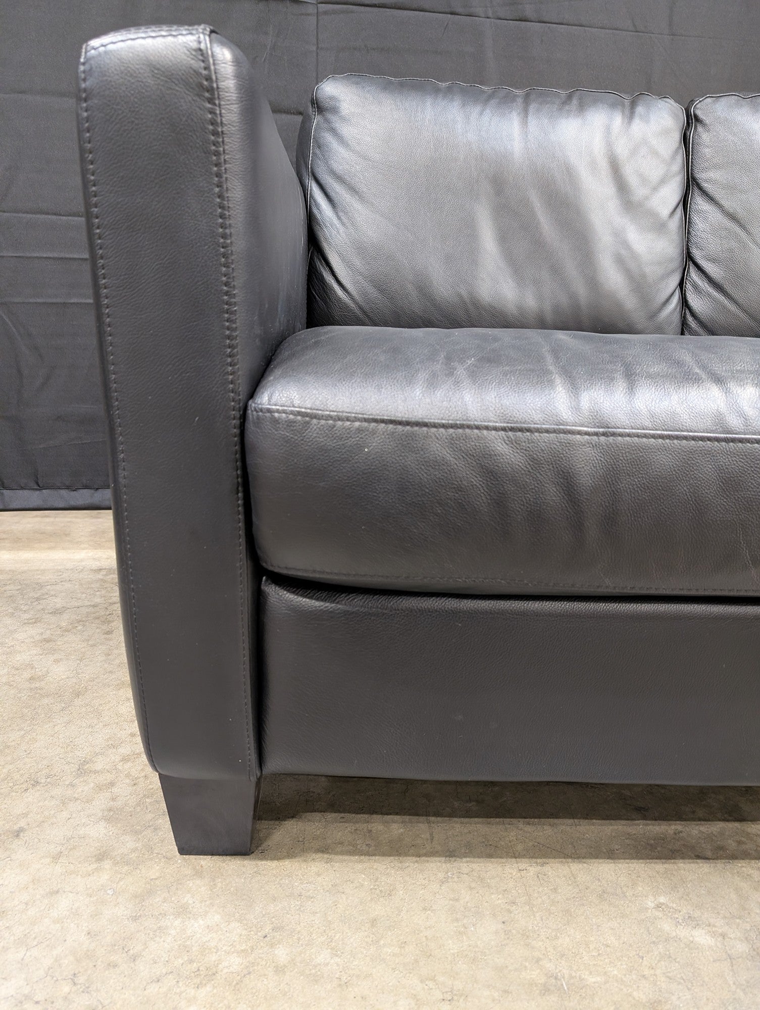 Modern Black Leather Three-Seater Sofa