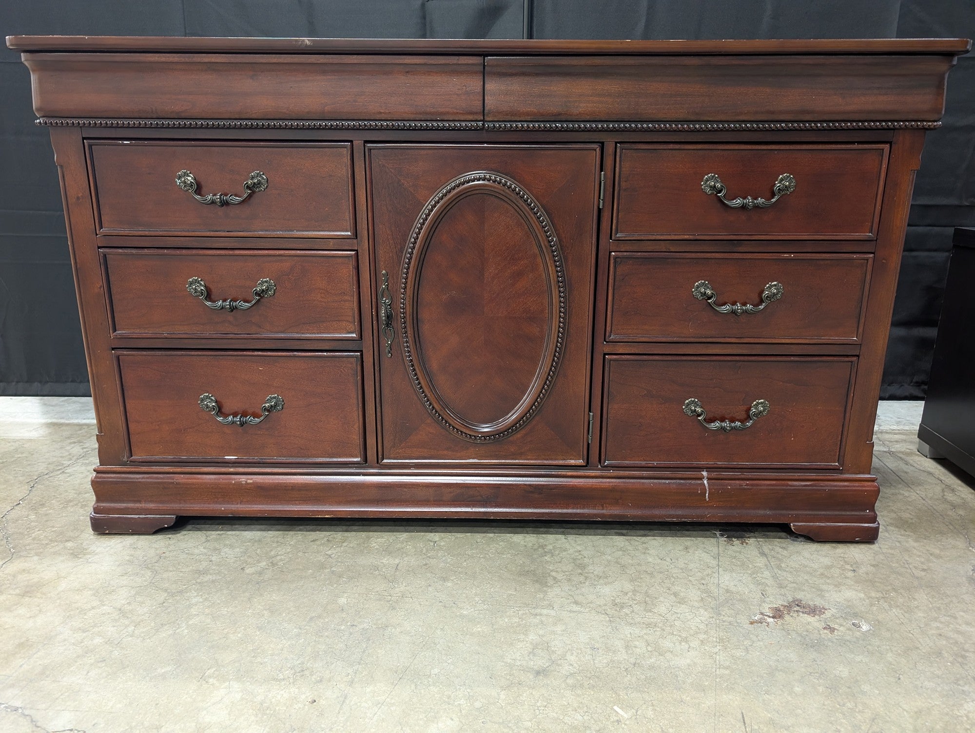 Traditional Dark Wood Dresser with Ornate Hardware