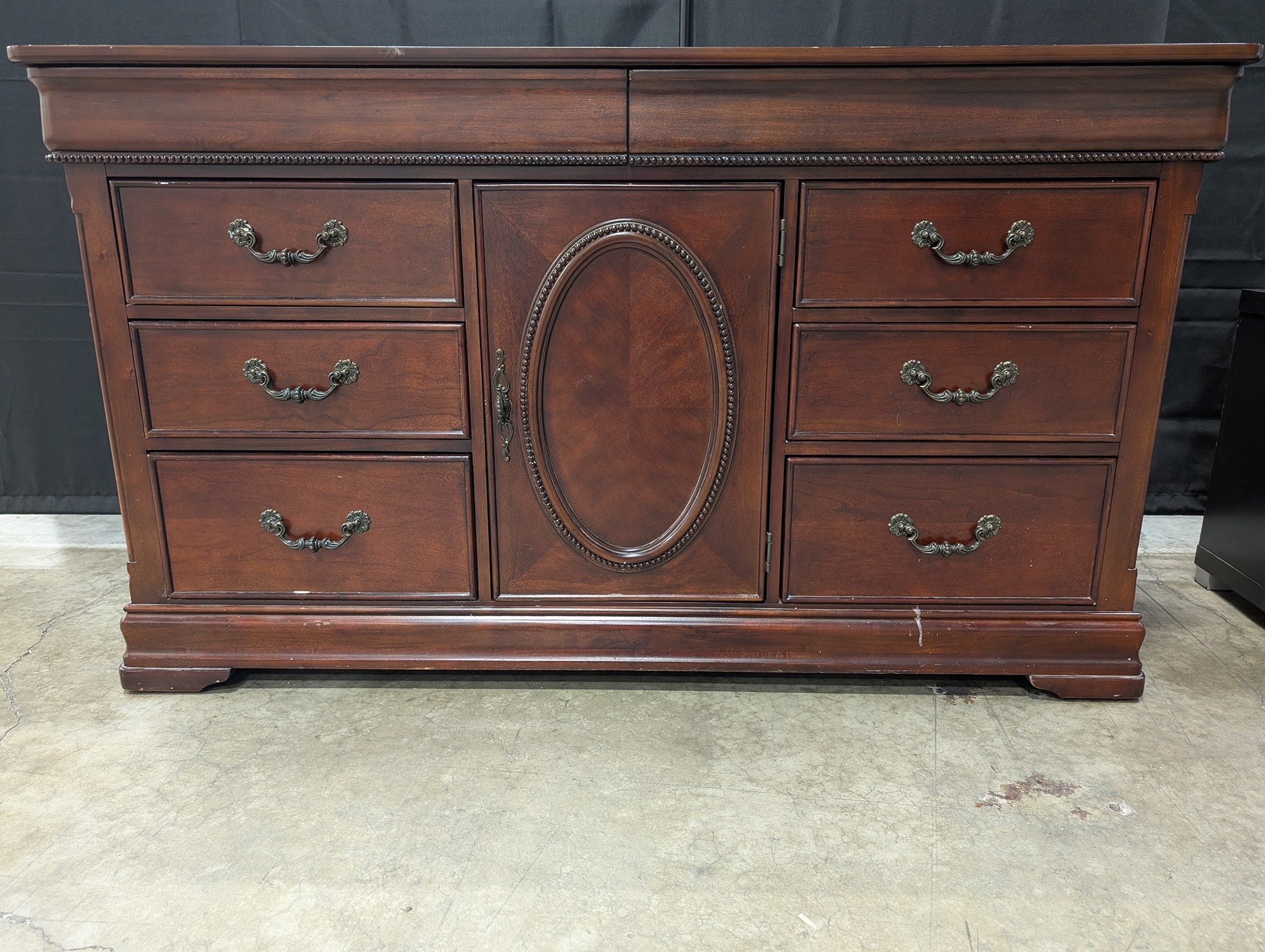 Traditional Dark Wood Dresser with Ornate Hardware