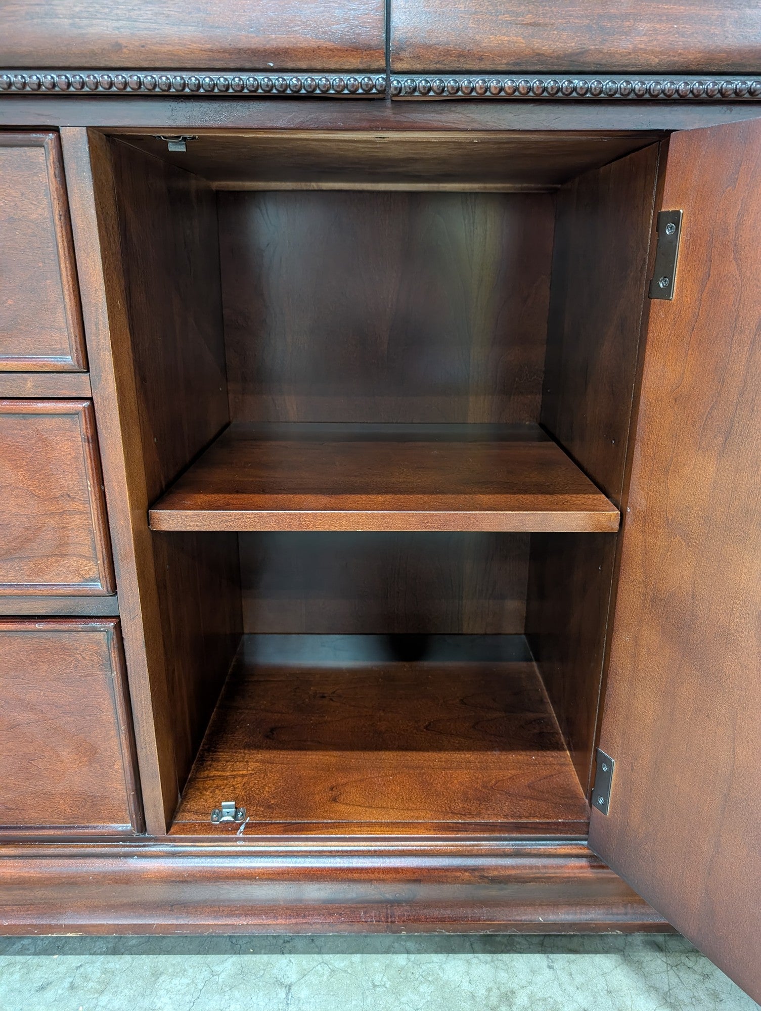 Traditional Dark Wood Dresser with Ornate Hardware