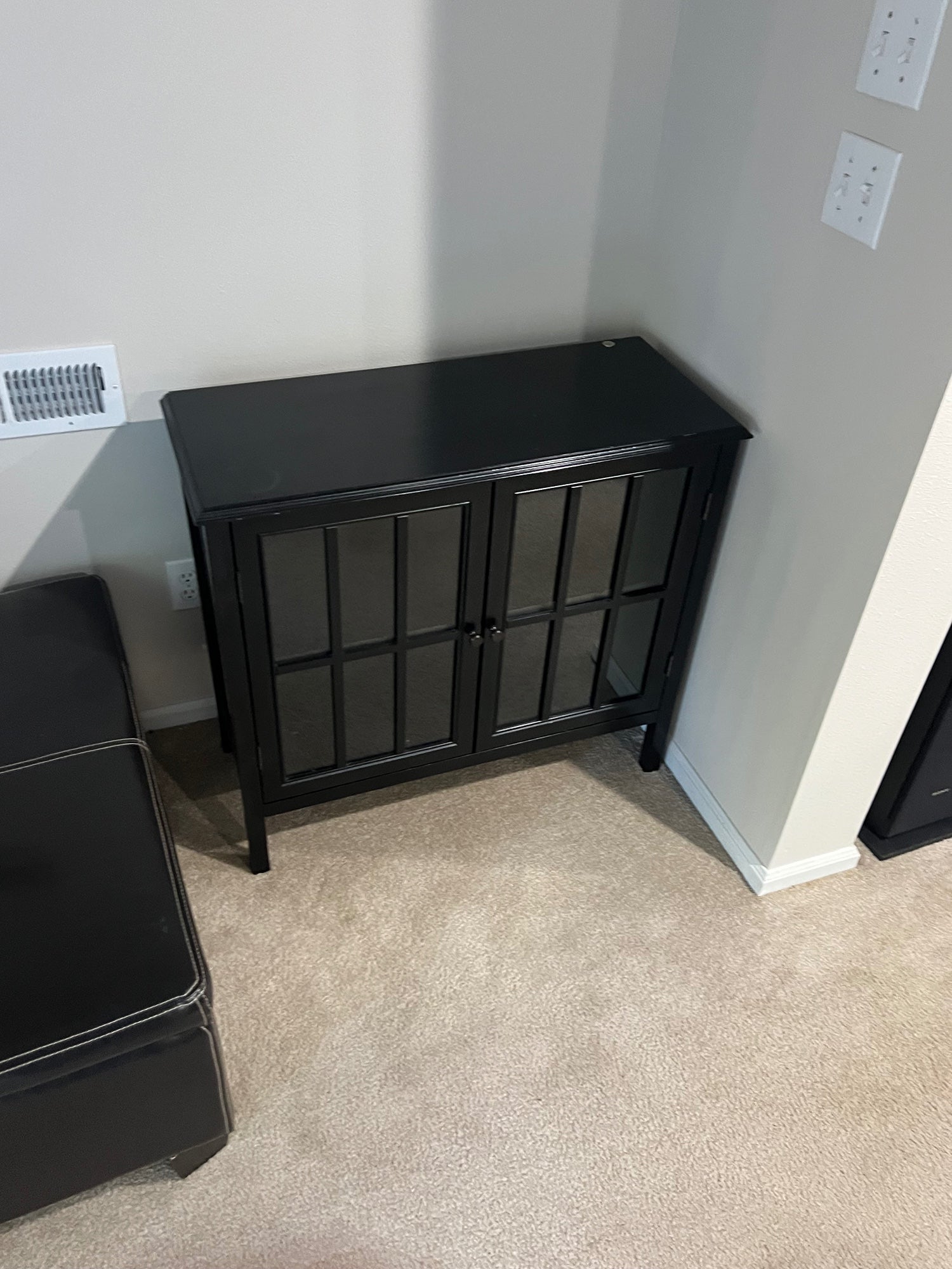 Stylish Black Wood Storage Cabinet with Glass Grid Doors and Tapered Legs
