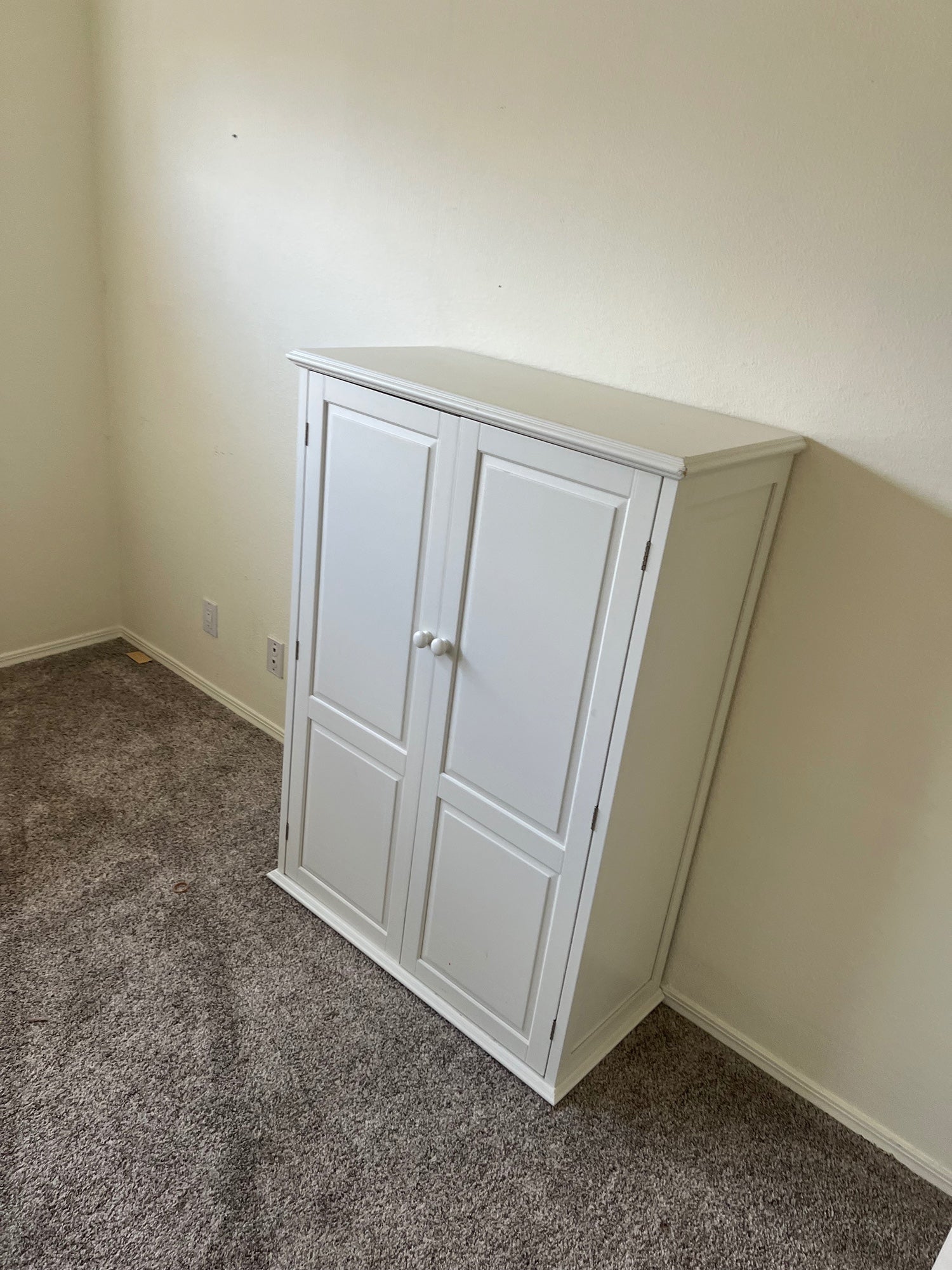 Versatile White Storage Cabinet with Paneled Doors