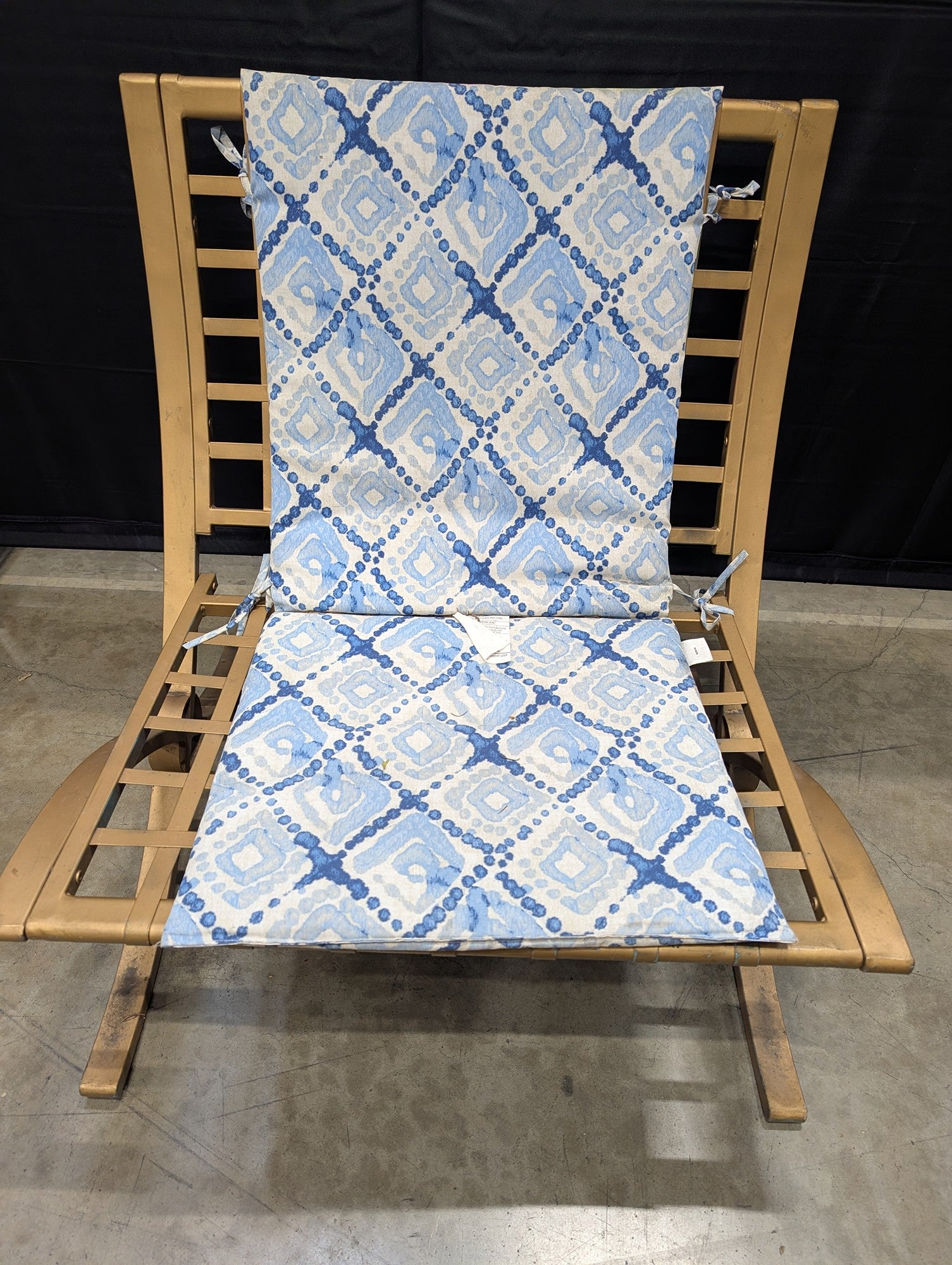 Outdoor Metal Chaise Lounge with Blue Ikat Patterned Cushion