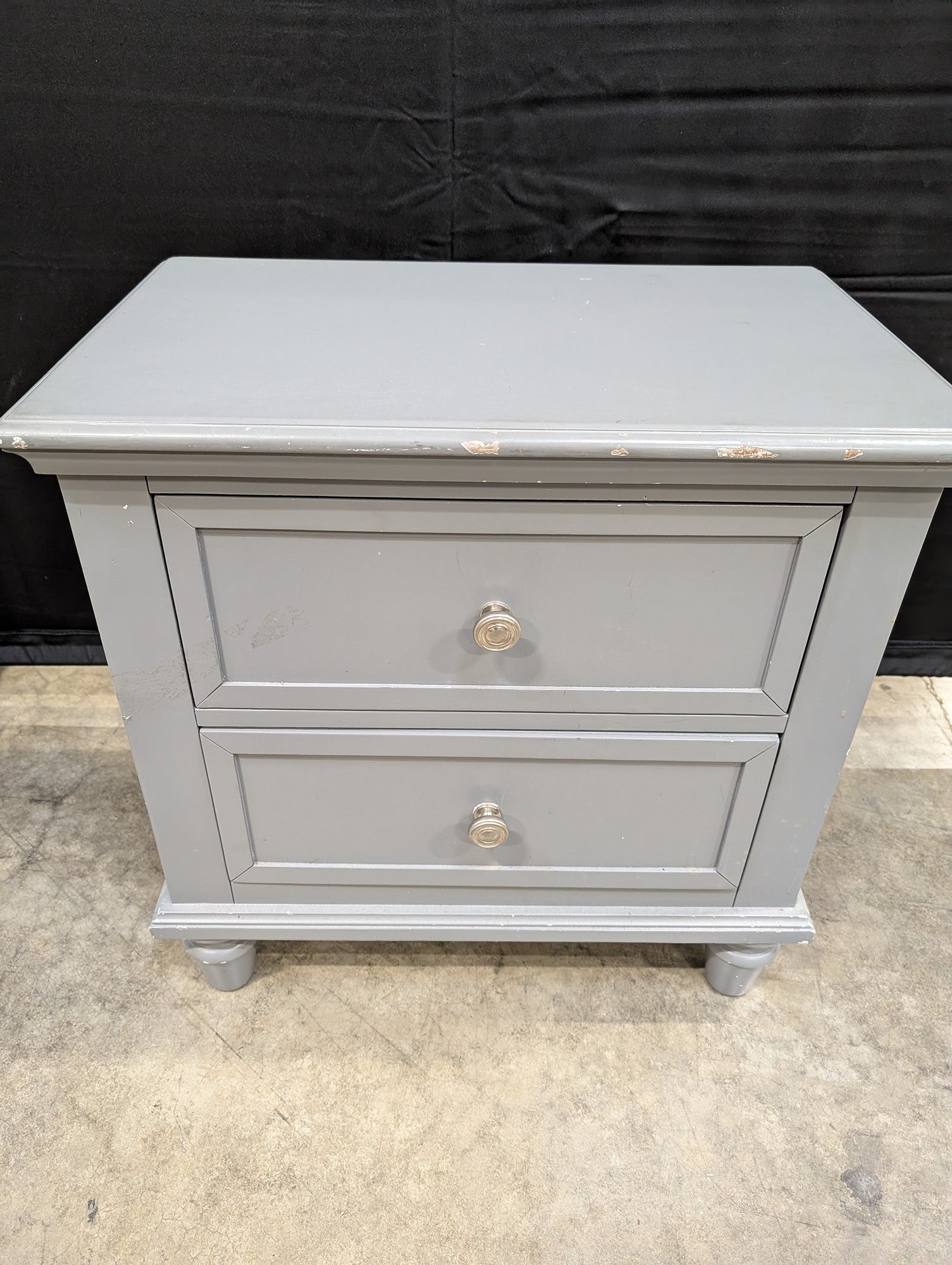 Charming Grey Two-Drawer Nightstand with Turned Feet