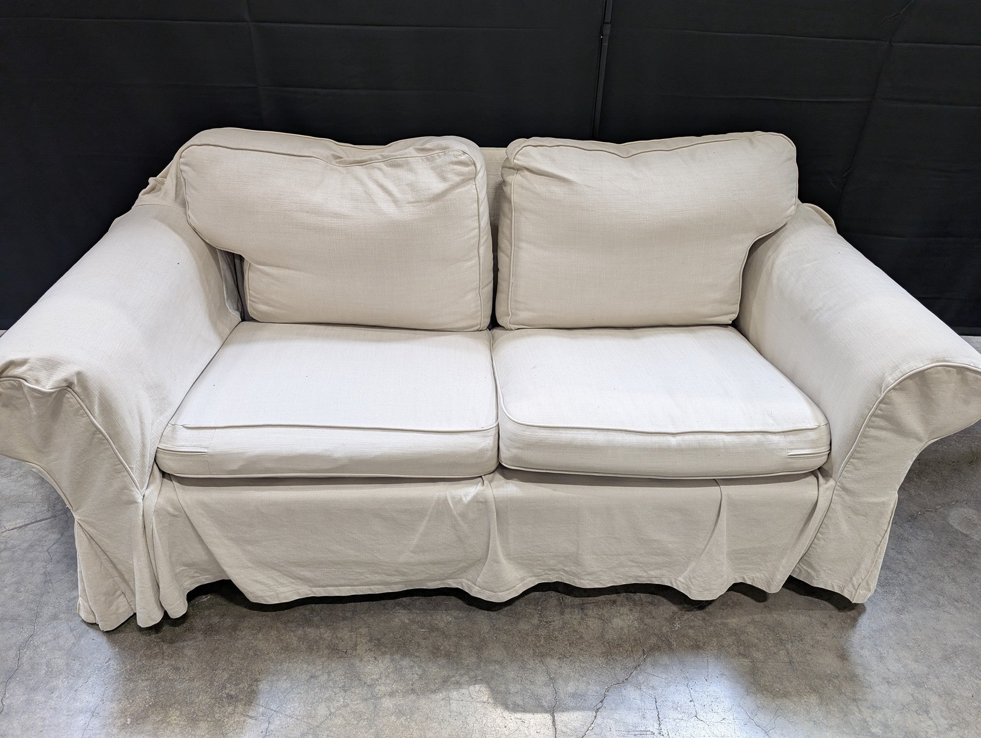 Cream Fabric Slipcovered Loveseat