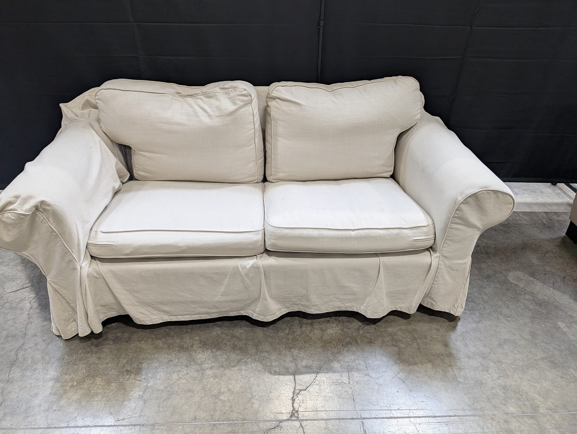 Cream Fabric Slipcovered Loveseat