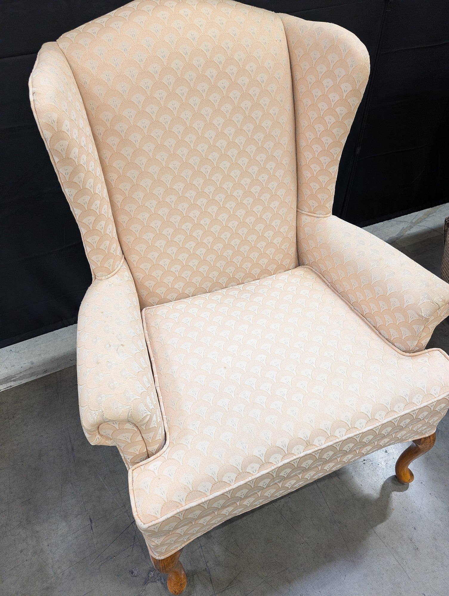 Traditional Upholstered Wingback Armchair with Scalloped Pattern