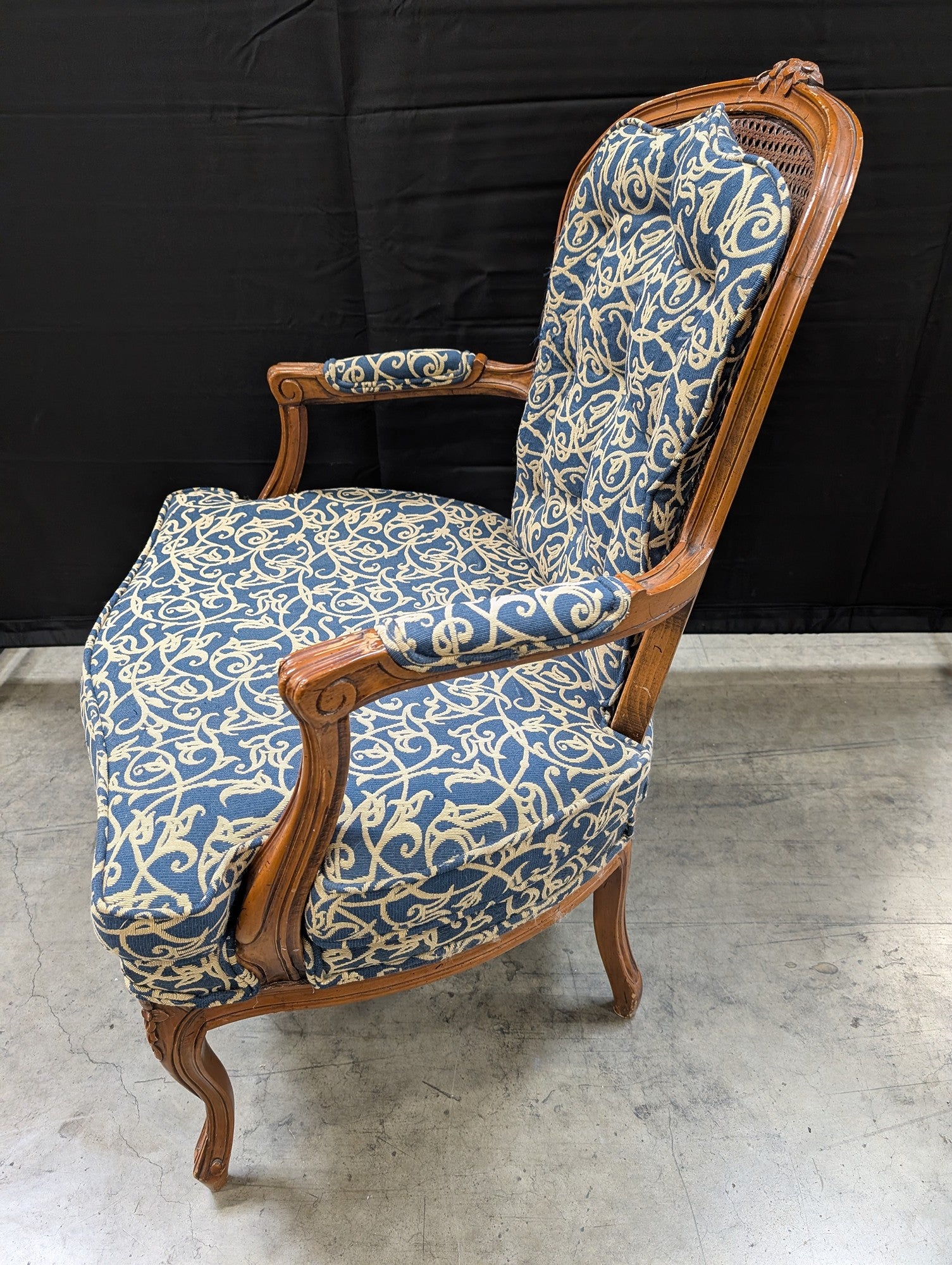 French Provincial Carved Wood Armchair with Cane Back