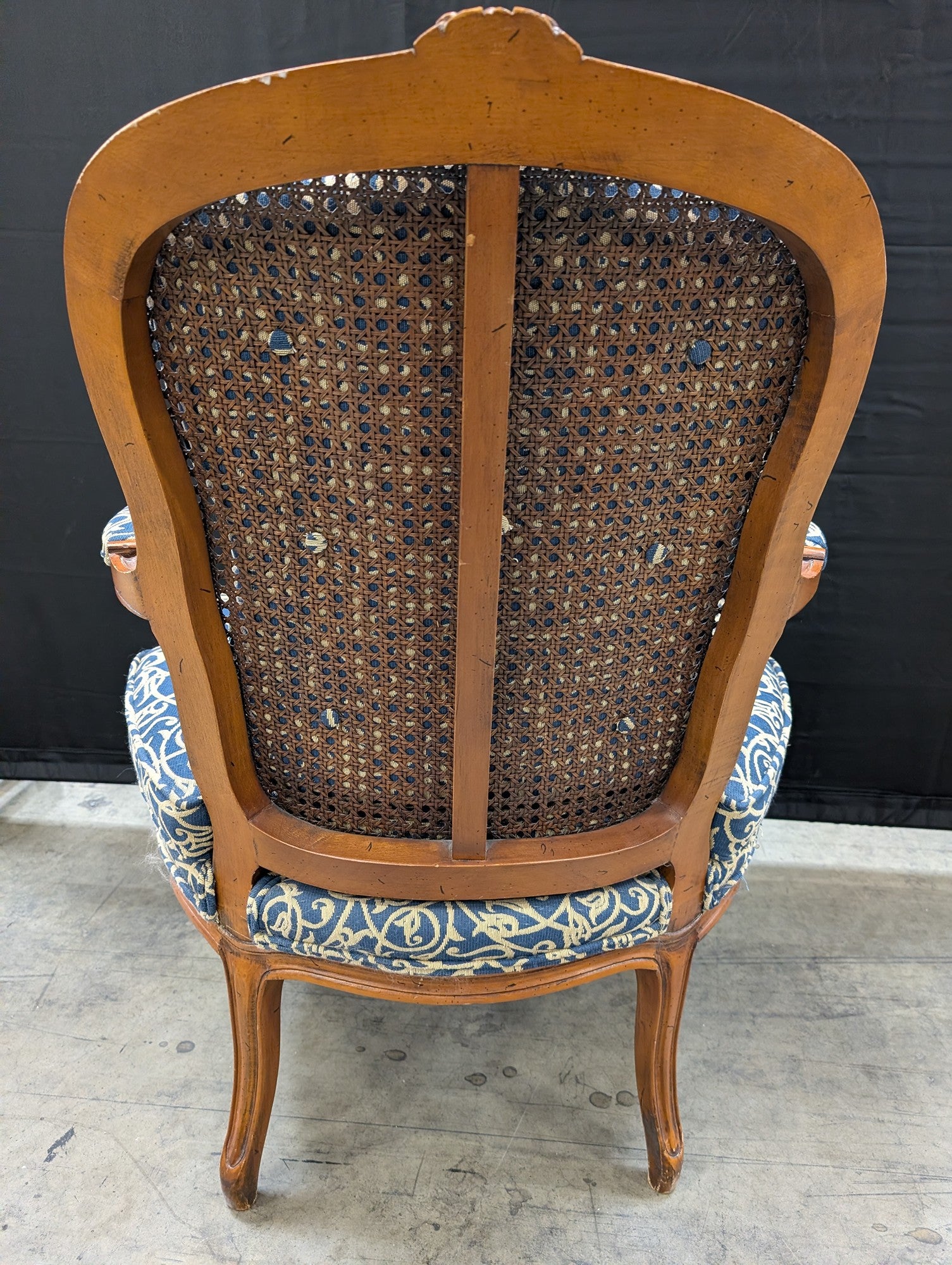 French Provincial Carved Wood Armchair with Cane Back