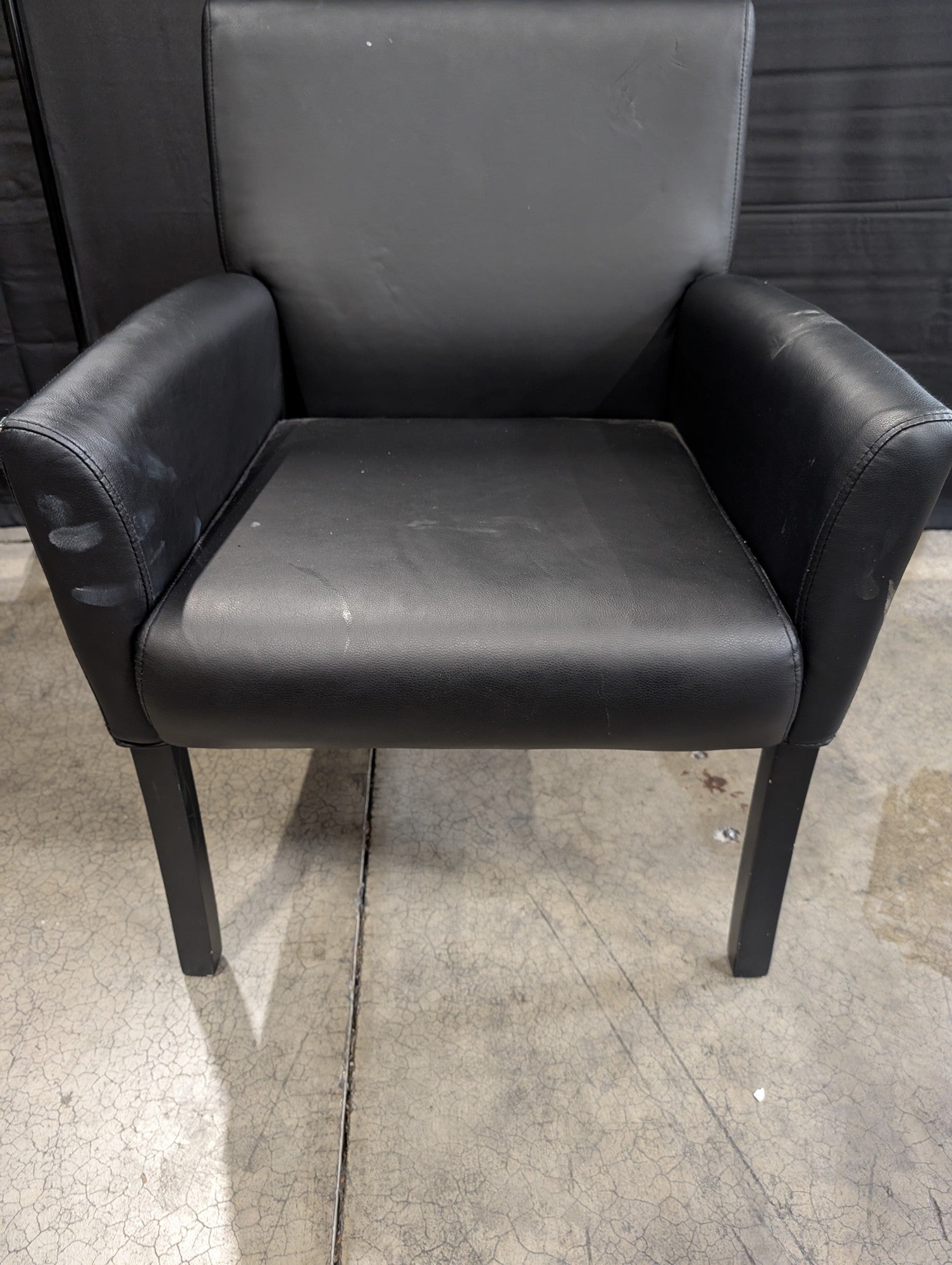 Modern Black Upholstered Armchair with Dark Legs