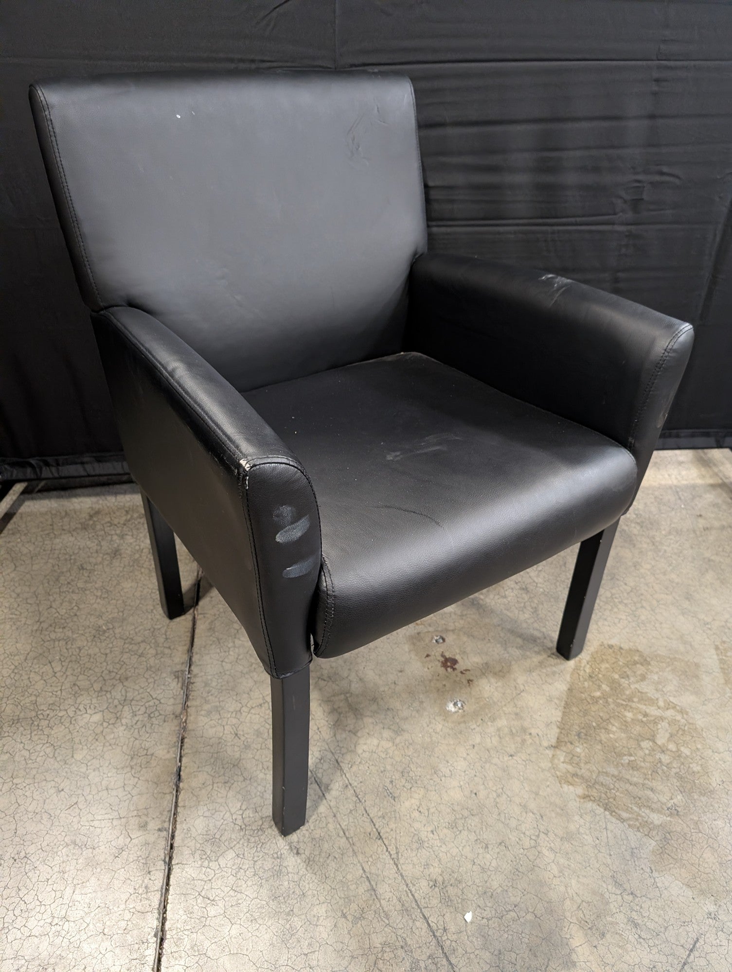 Modern Black Upholstered Armchair with Dark Legs