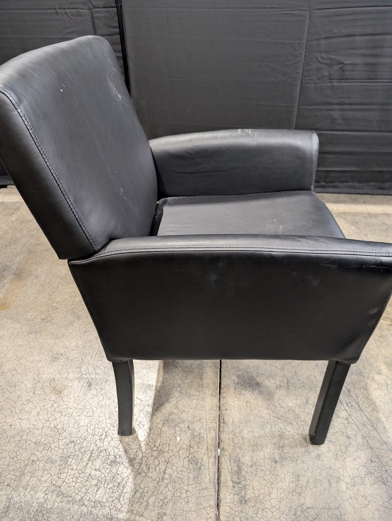 Modern Black Upholstered Armchair with Dark Legs