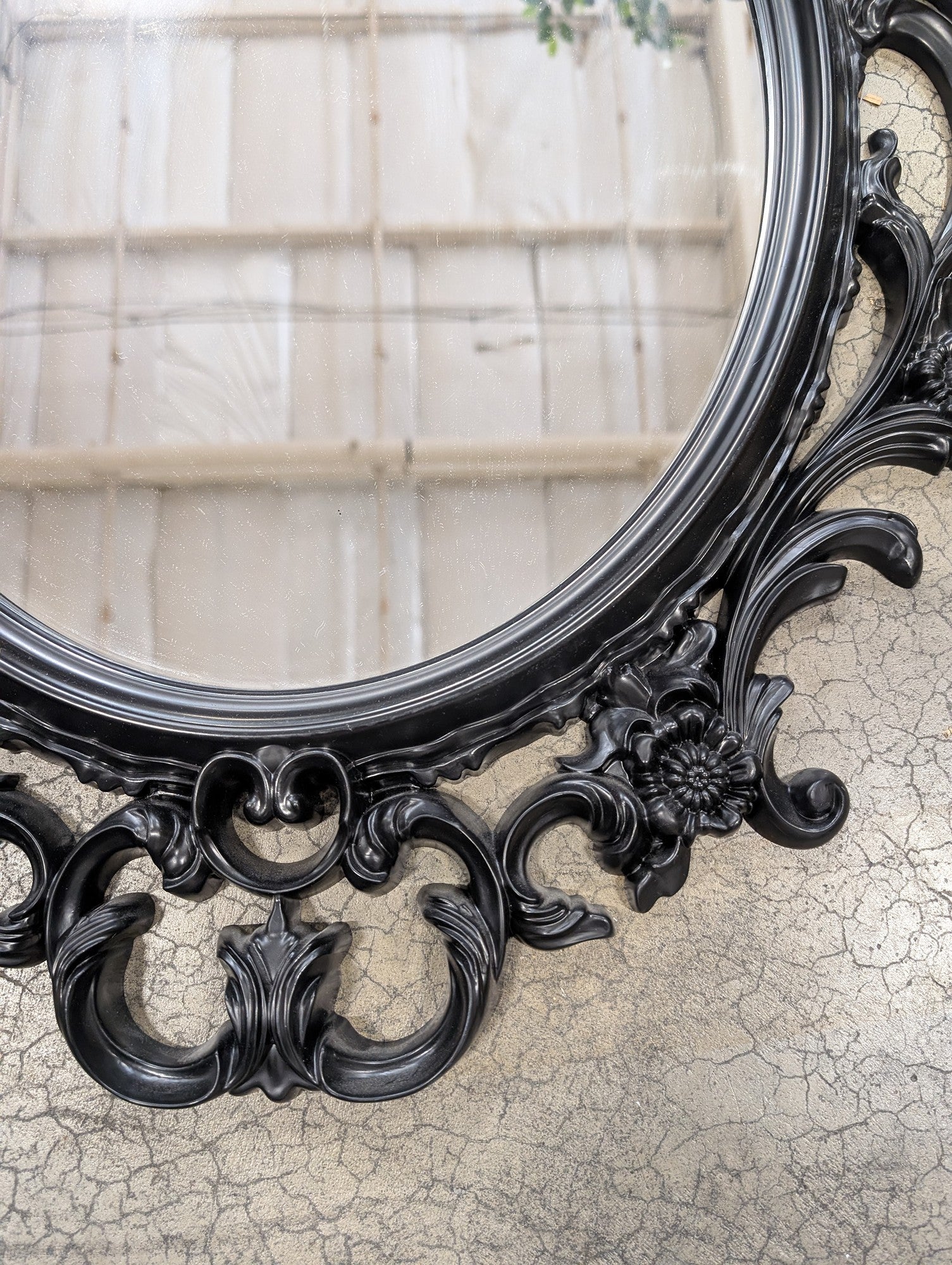 Ornate Black Oval Wall Mirror with Rococo-Inspired Plastic Frame
