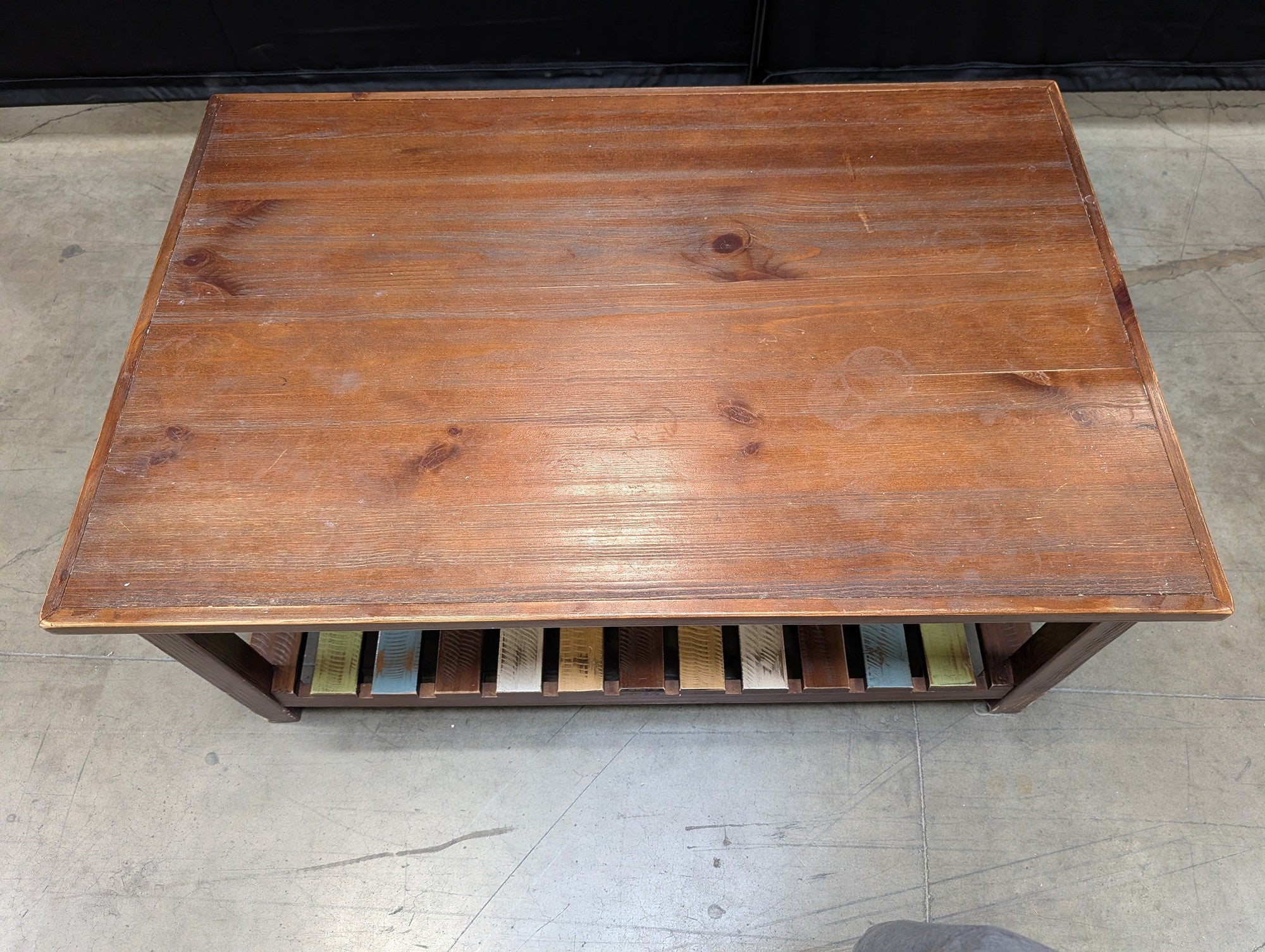 Rustic Wood Coffee Table with Multi-Color Slatted Shelf