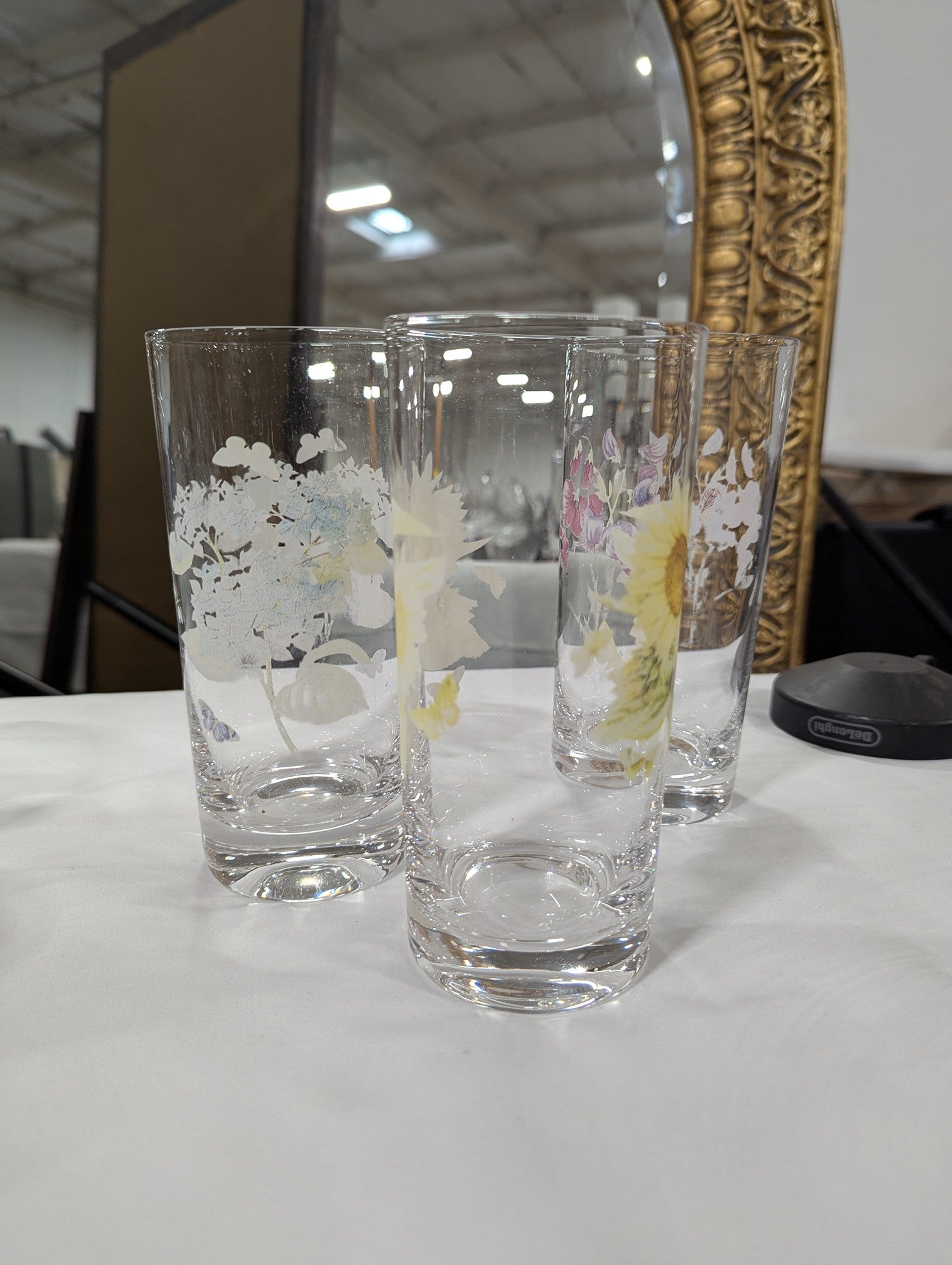 Set of Four Clear Glass Highball Tumblers with Assorted Floral Butterfly Designs