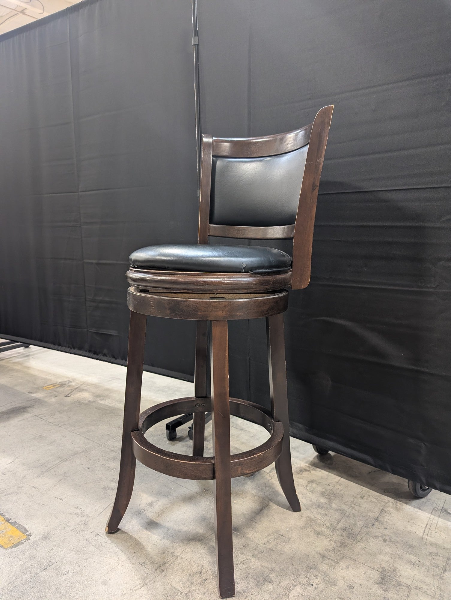 Dark Wood Swivel Bar Stool with Black Upholstery