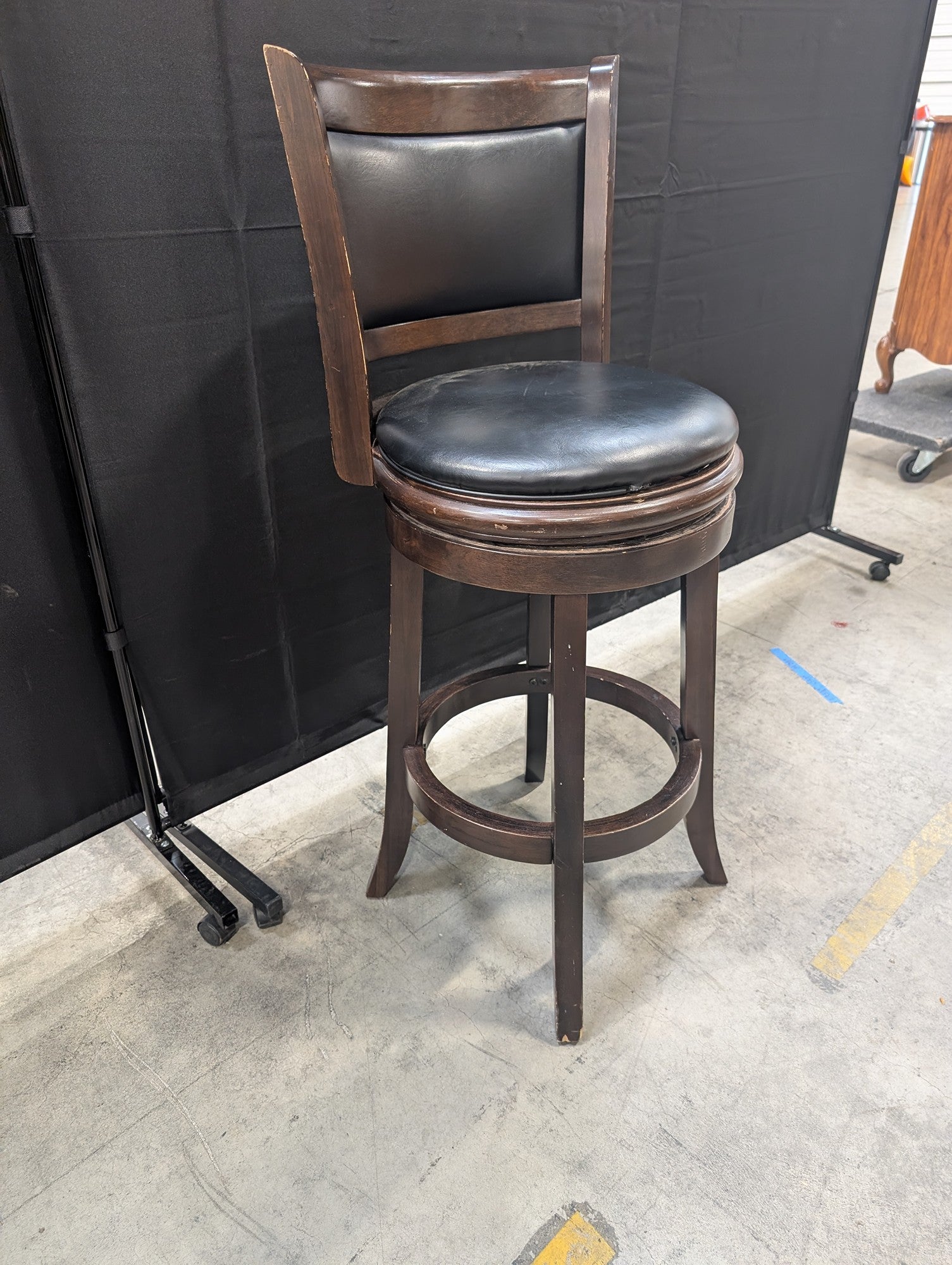 Dark Wood Swivel Bar Stool with Black Upholstery