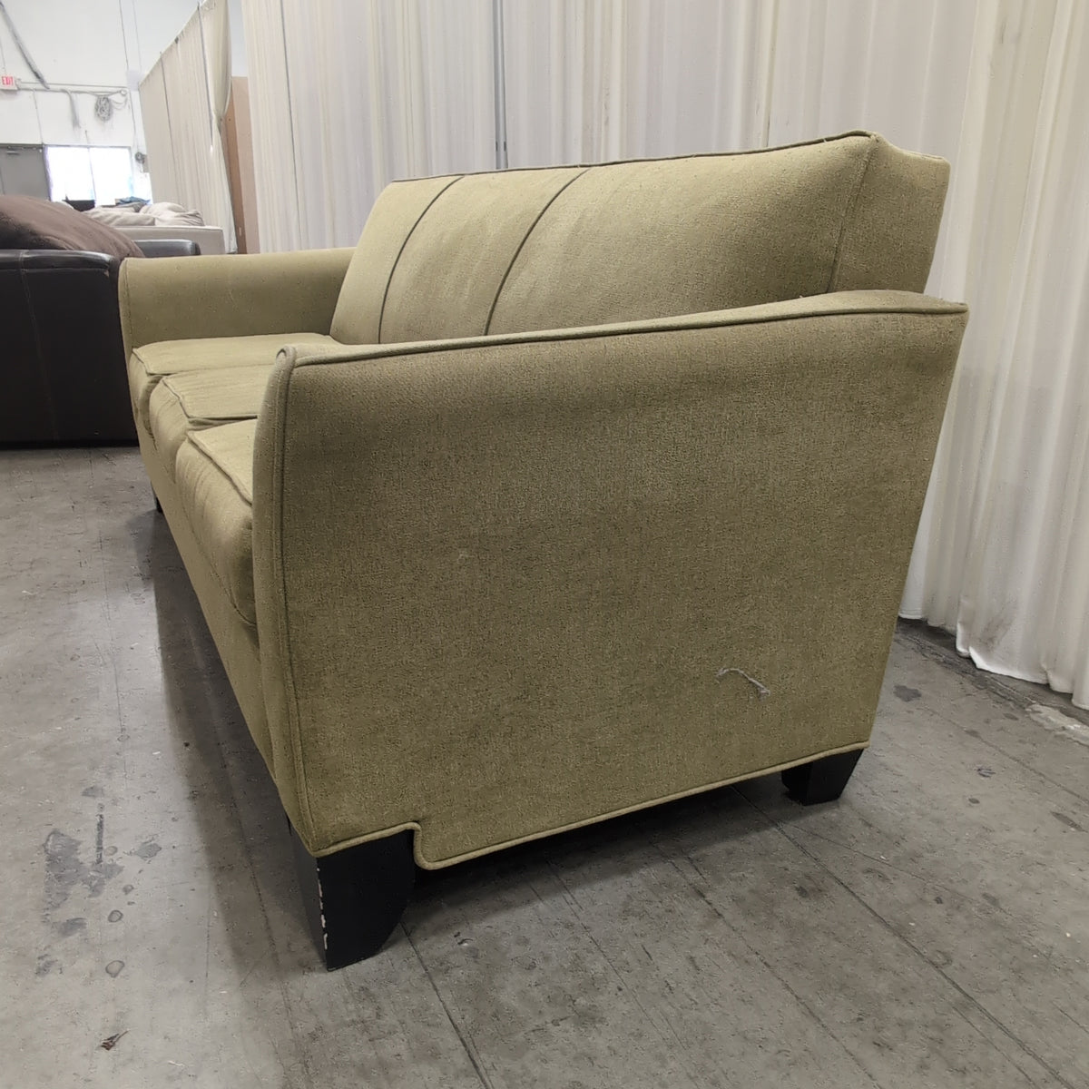Tan Fabric Three-Cushion Couch with Rolled Arms