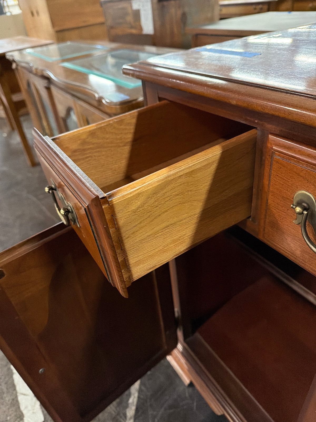 Traditional Cherry-Toned Wood Buffet with Ornate Hardware