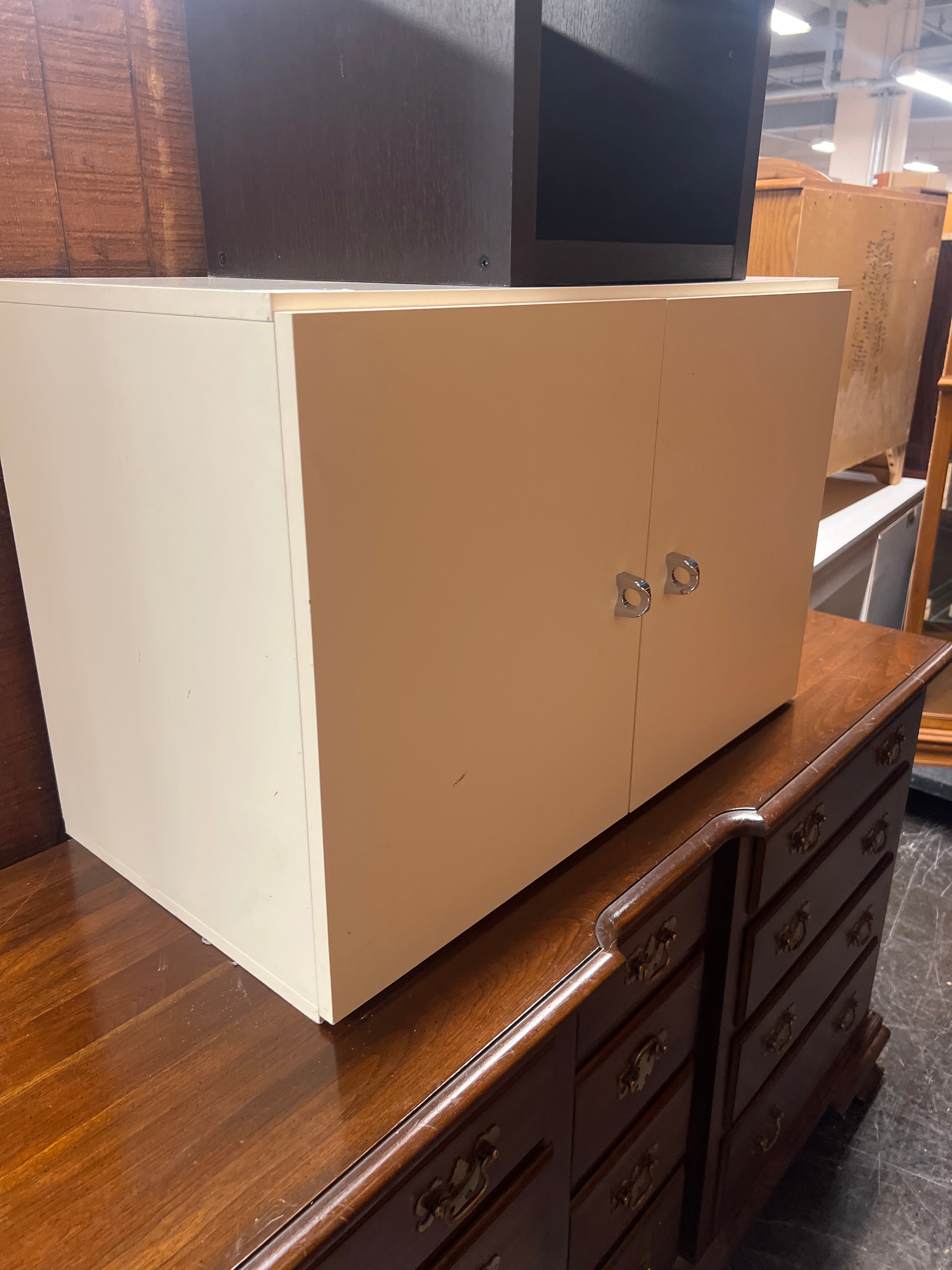 White cabinet with metal pulls