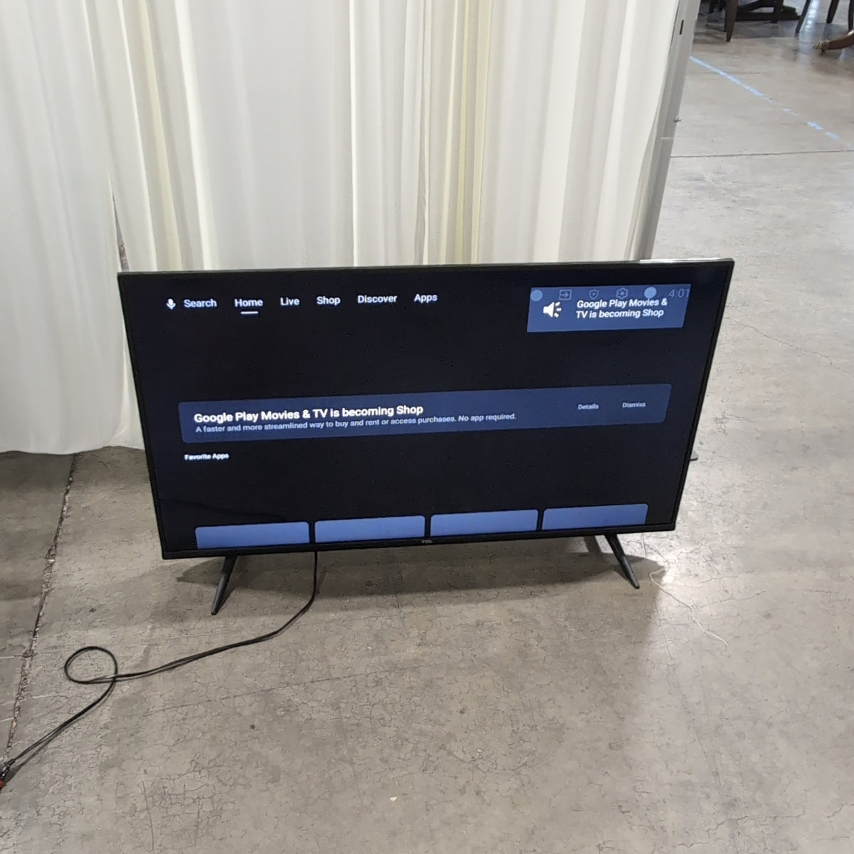 Black TCL Flat-Screen TV with Stand