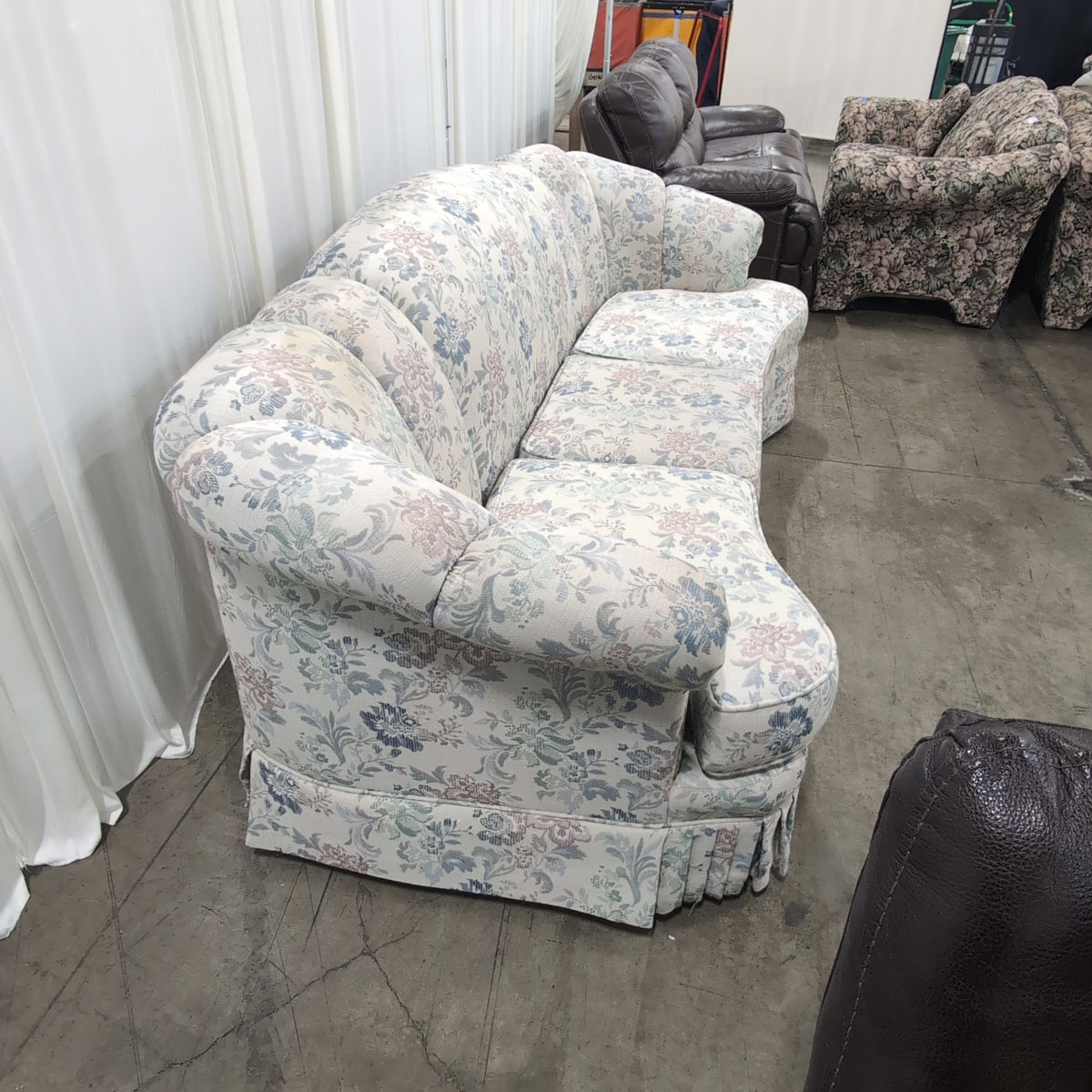 Floral Pattern Skirted Upholstered Couch with Rolled Arms