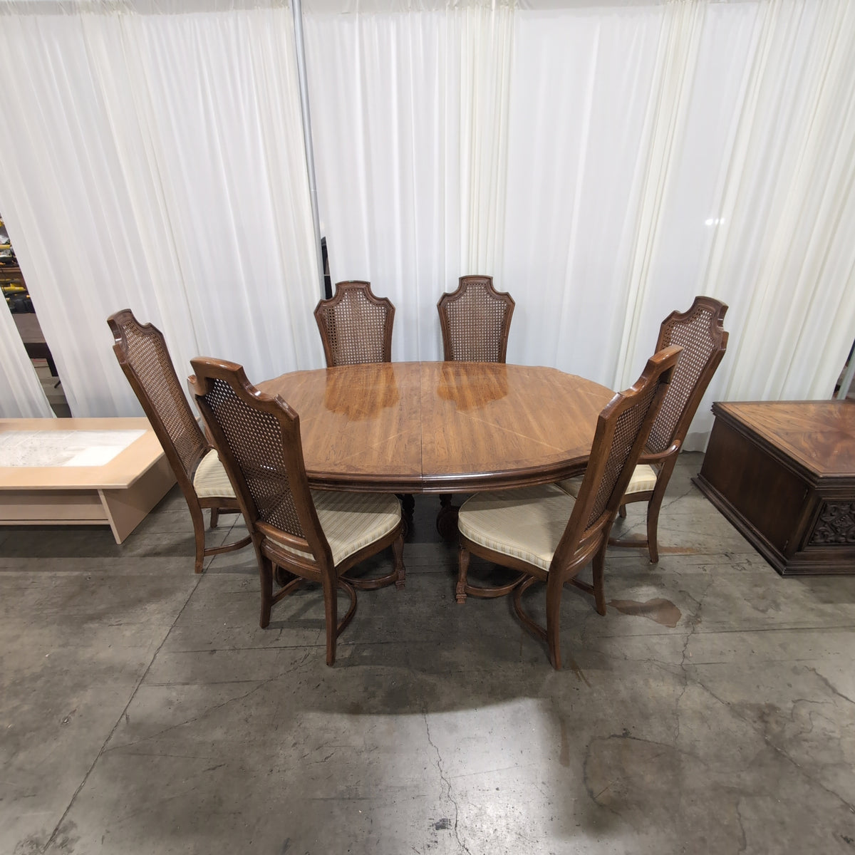 Ornate Brown Wood Dining Table With Six Cane Back Chairs
