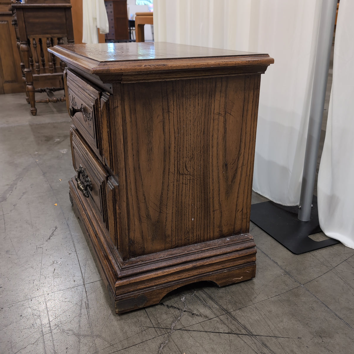 Traditional Dark Wood Two-Drawer Nightstand with Ornate Hardware