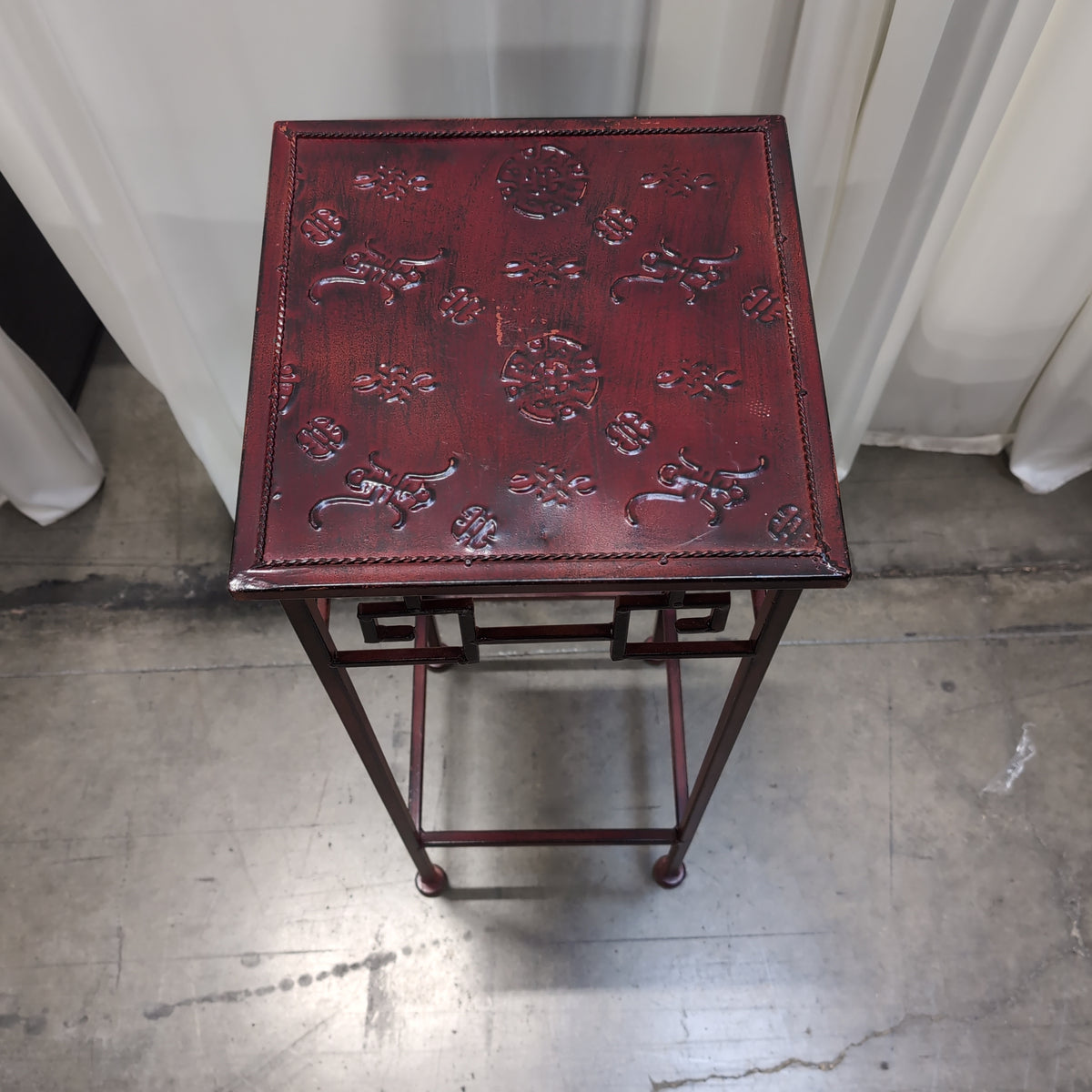 Burgundy Metal Display Stand with Patterned Top