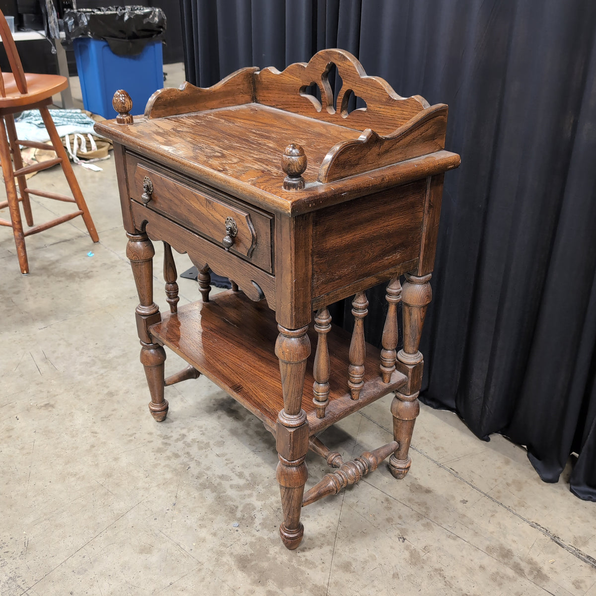 Dark Stained Wood Nightstand with Ornate Hardware