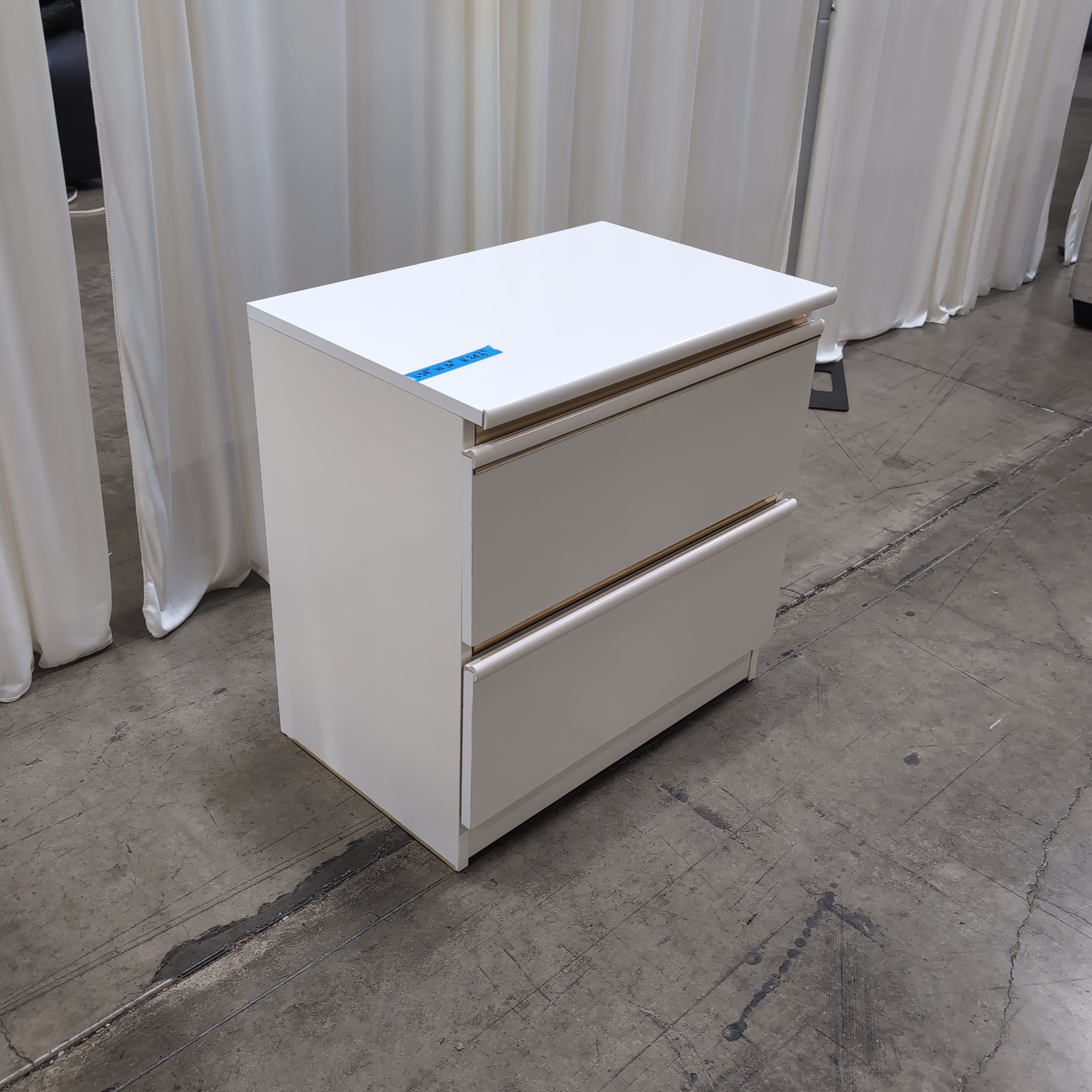 White Two-Drawer Nightstand with Gold Accents