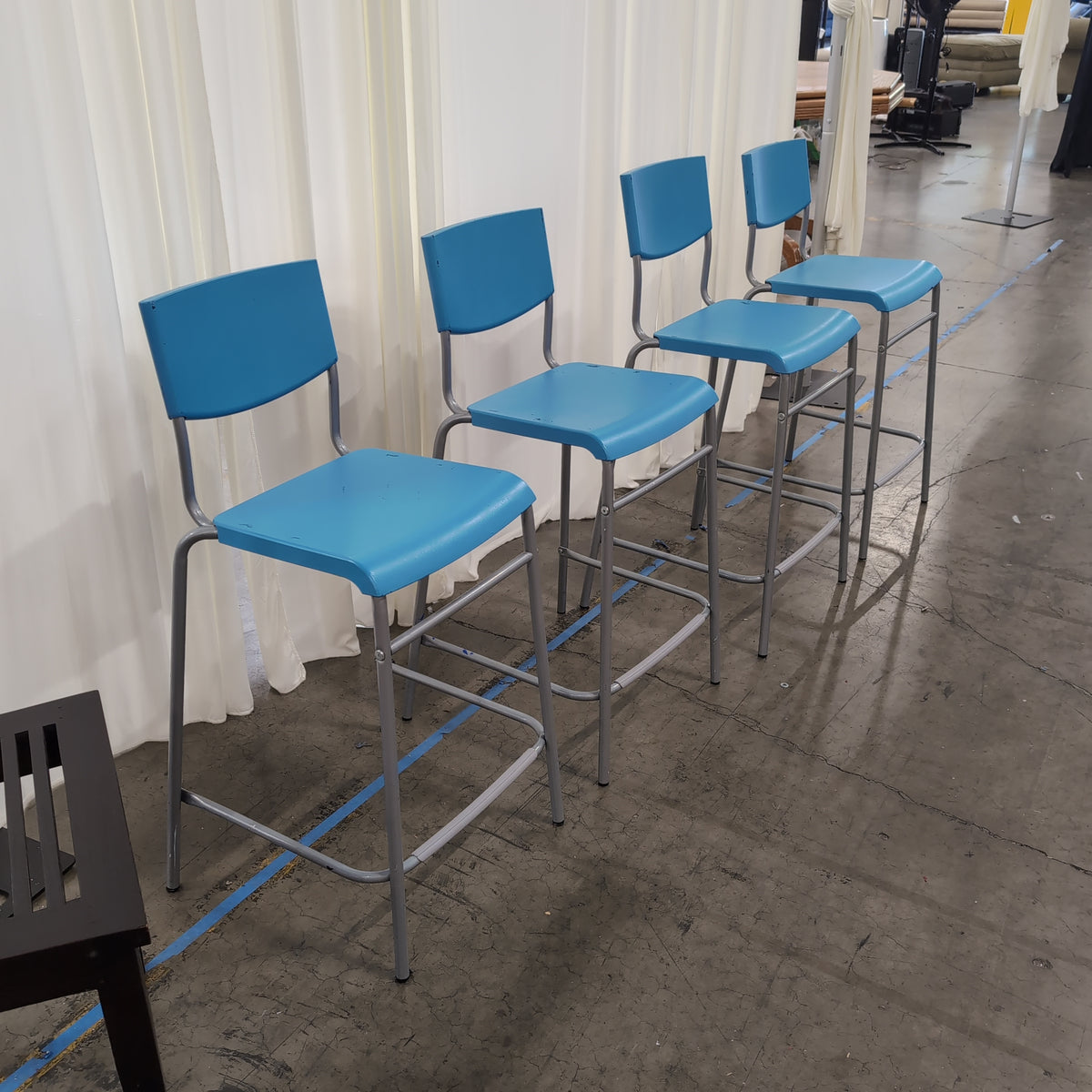 Set of Four Stackable Blue Plastic Chairs