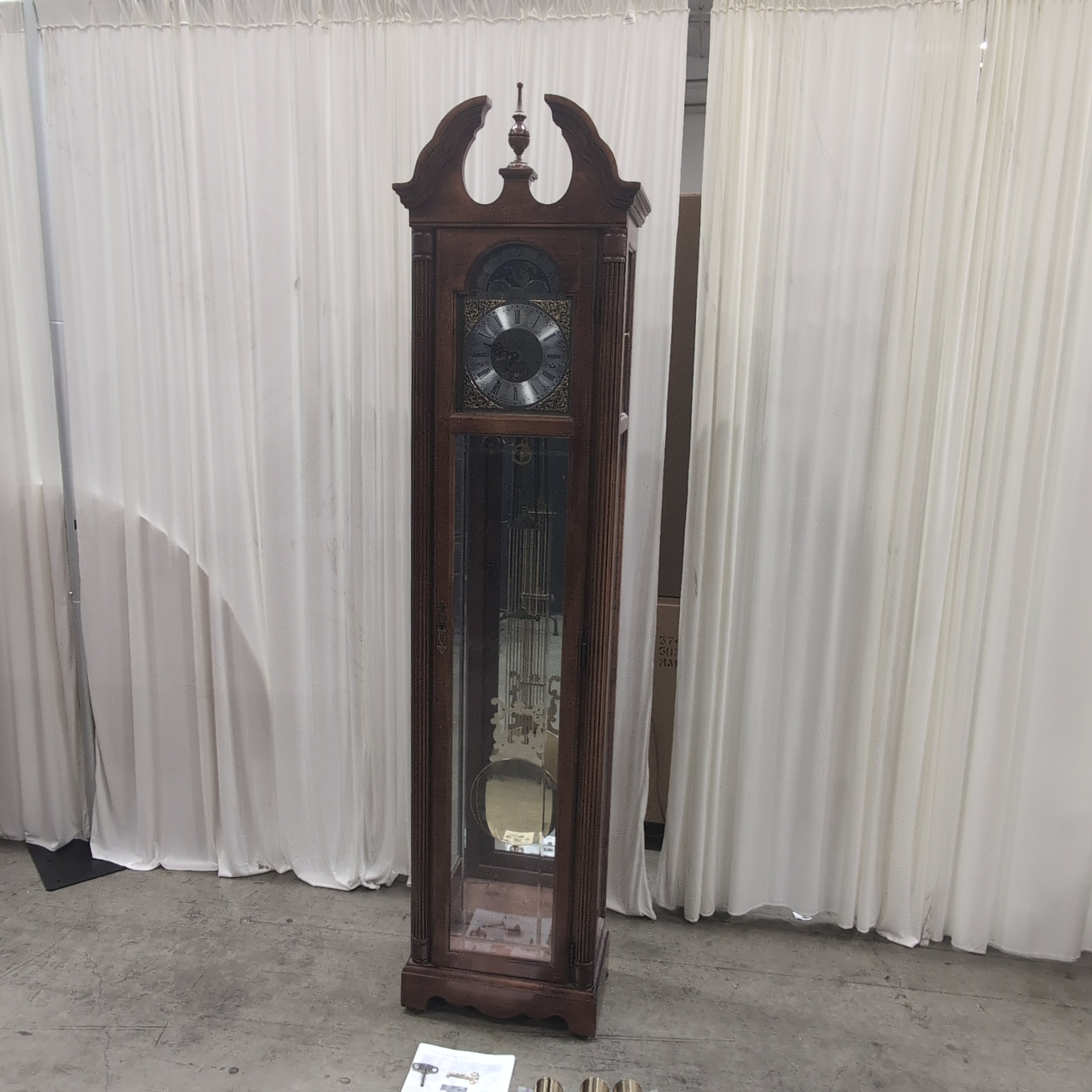 Howard Miller Decorative Wood Grandfather Clock with Brass Pendulum