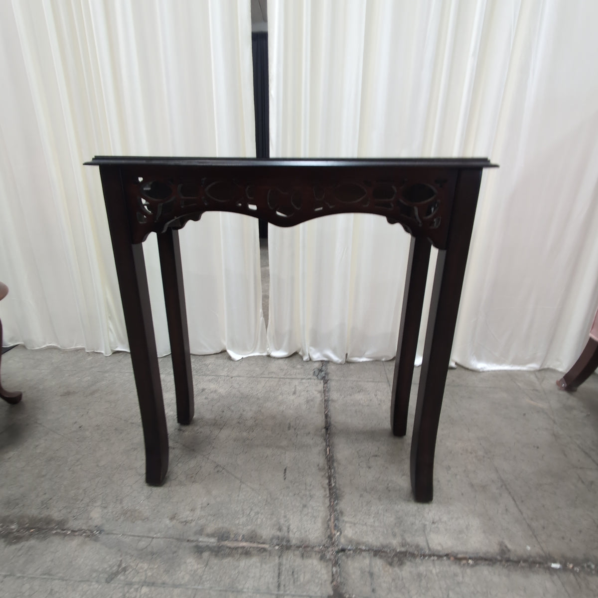 Dark Stained Wood Console Table with Ornate Details