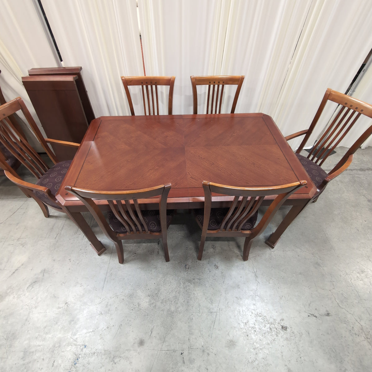 Dark Stained Wood Dining Table with Chamfered Corners