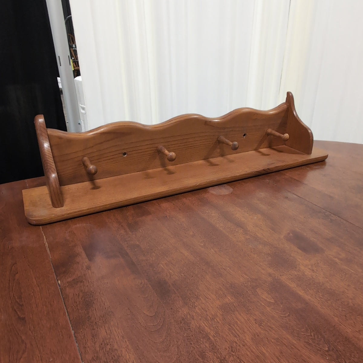 Natural Wood Scalloped Wall Shelf with Four Pegs