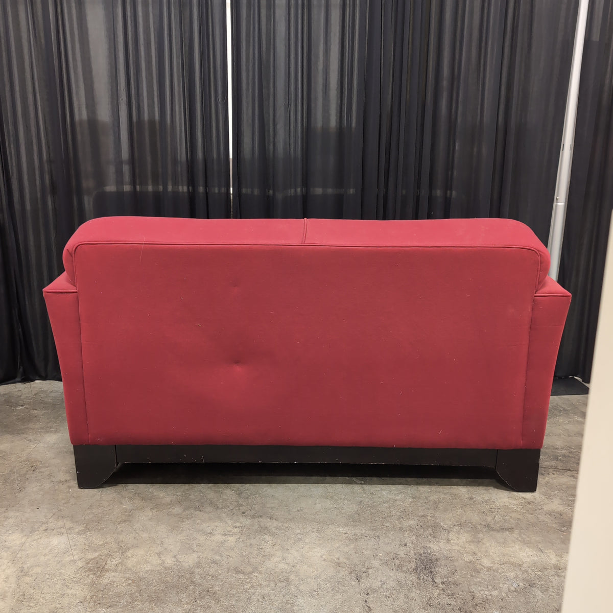 Red Upholstered Two-Cushion Fabric Loveseat with Dark Wood Base