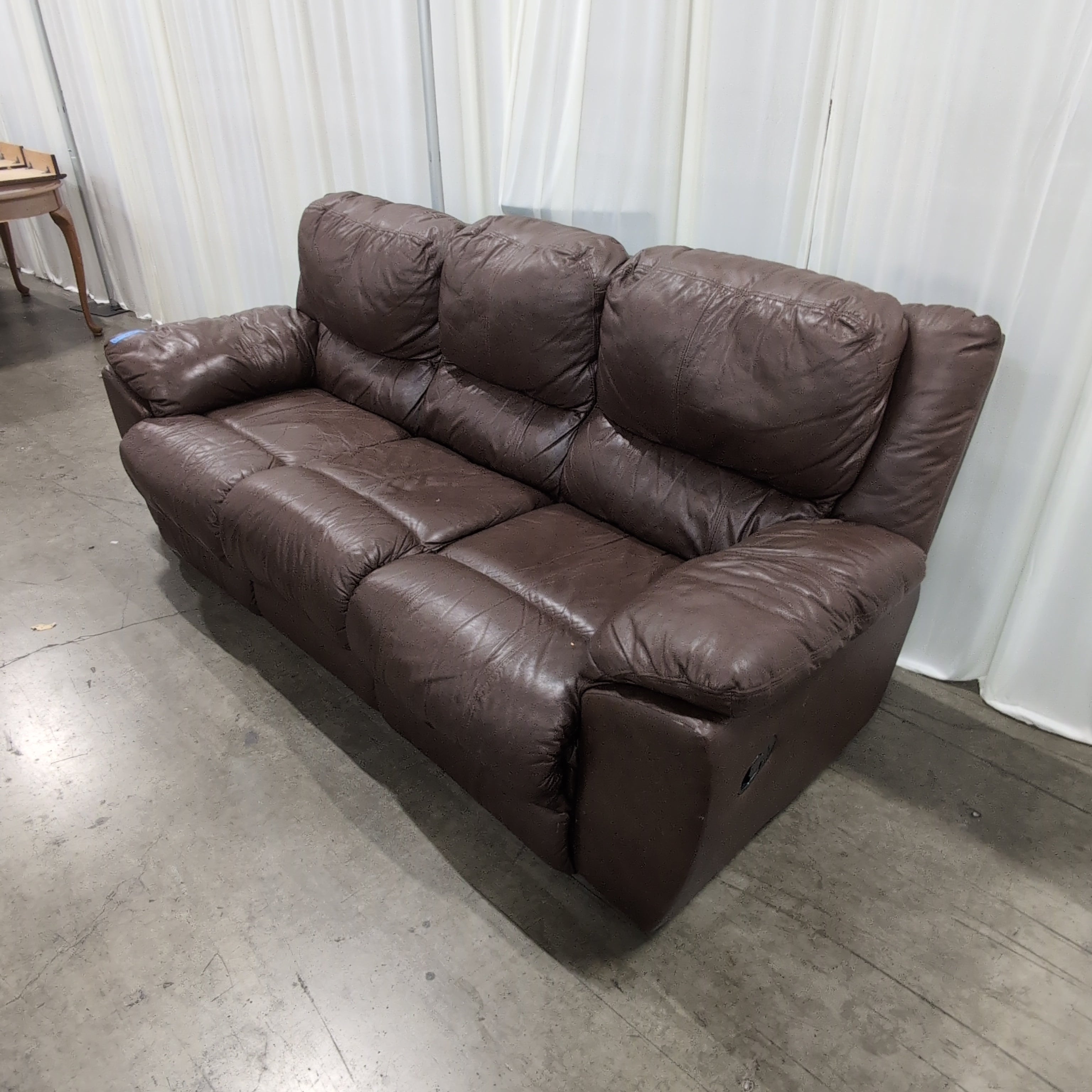 Brown Leather Three-Seat Recliner Couch