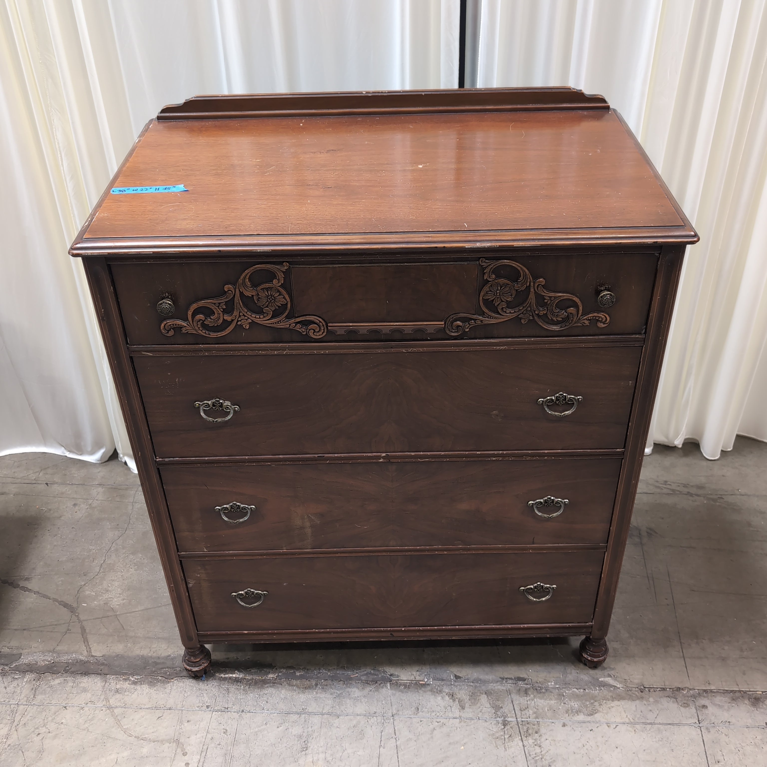 Vintage Dark Wood Four-Drawer Dresser with Ornate Carving