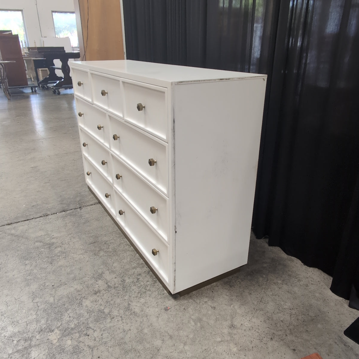 Clean-Lined White Nine-Drawer Dresser with Brass Knobs