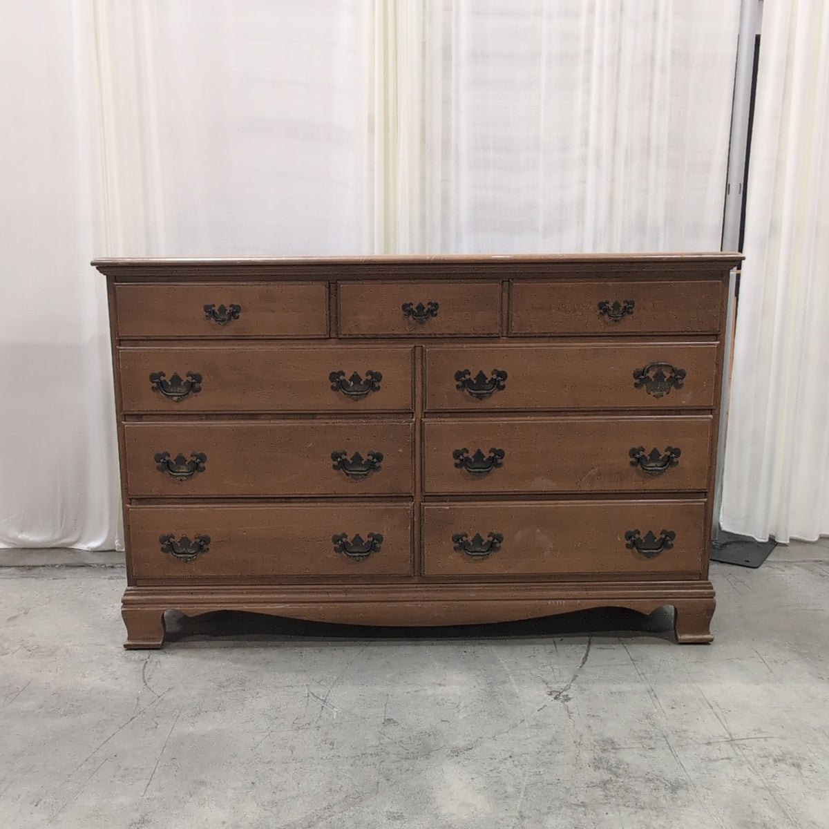 Traditional Honey Tone Nine-Drawer Dresser with Ornate Hardware