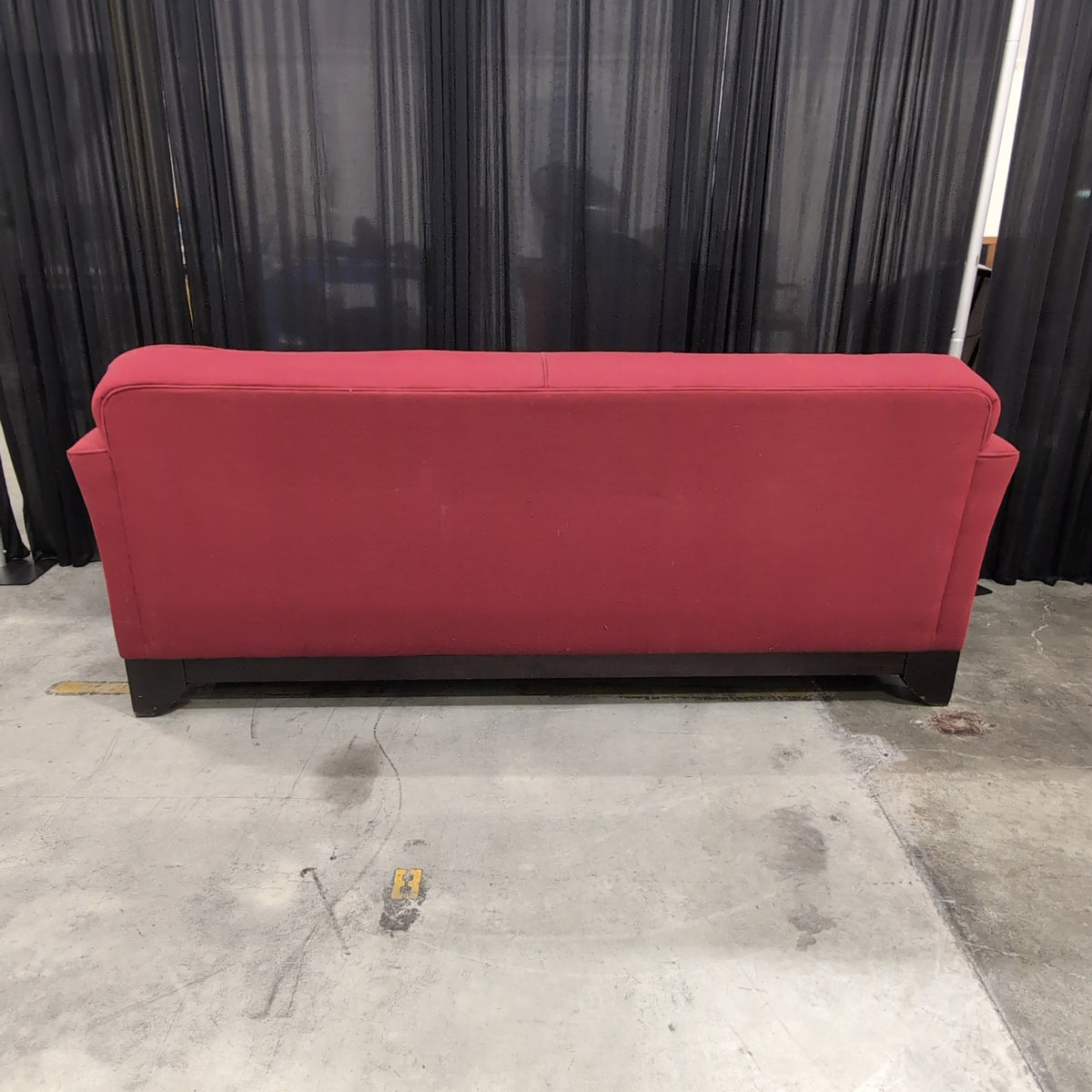 Red Fabric Upholstered Two-Cushion Couch
