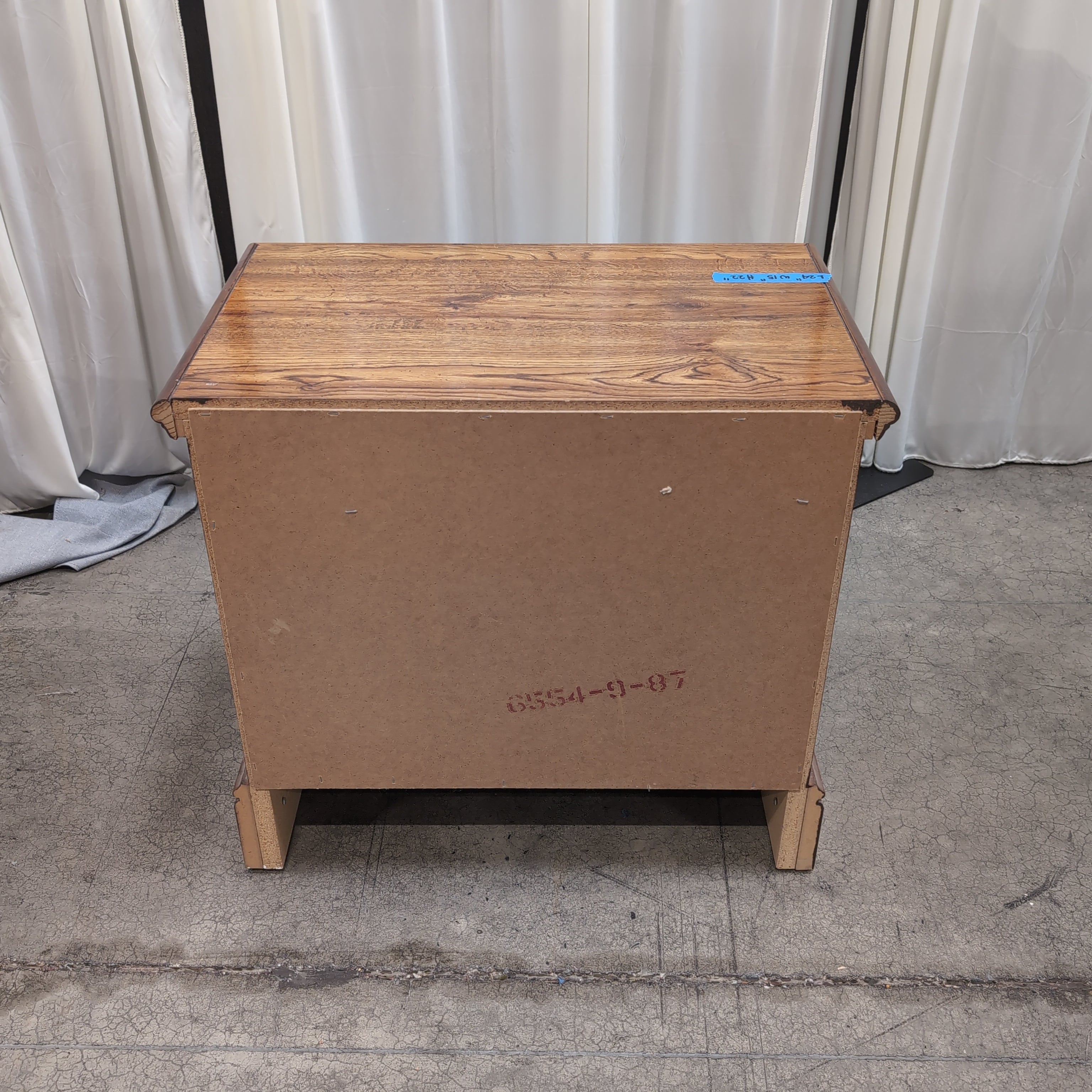 Brown Two-Drawer Wood Nightstand with Ornate Pulls